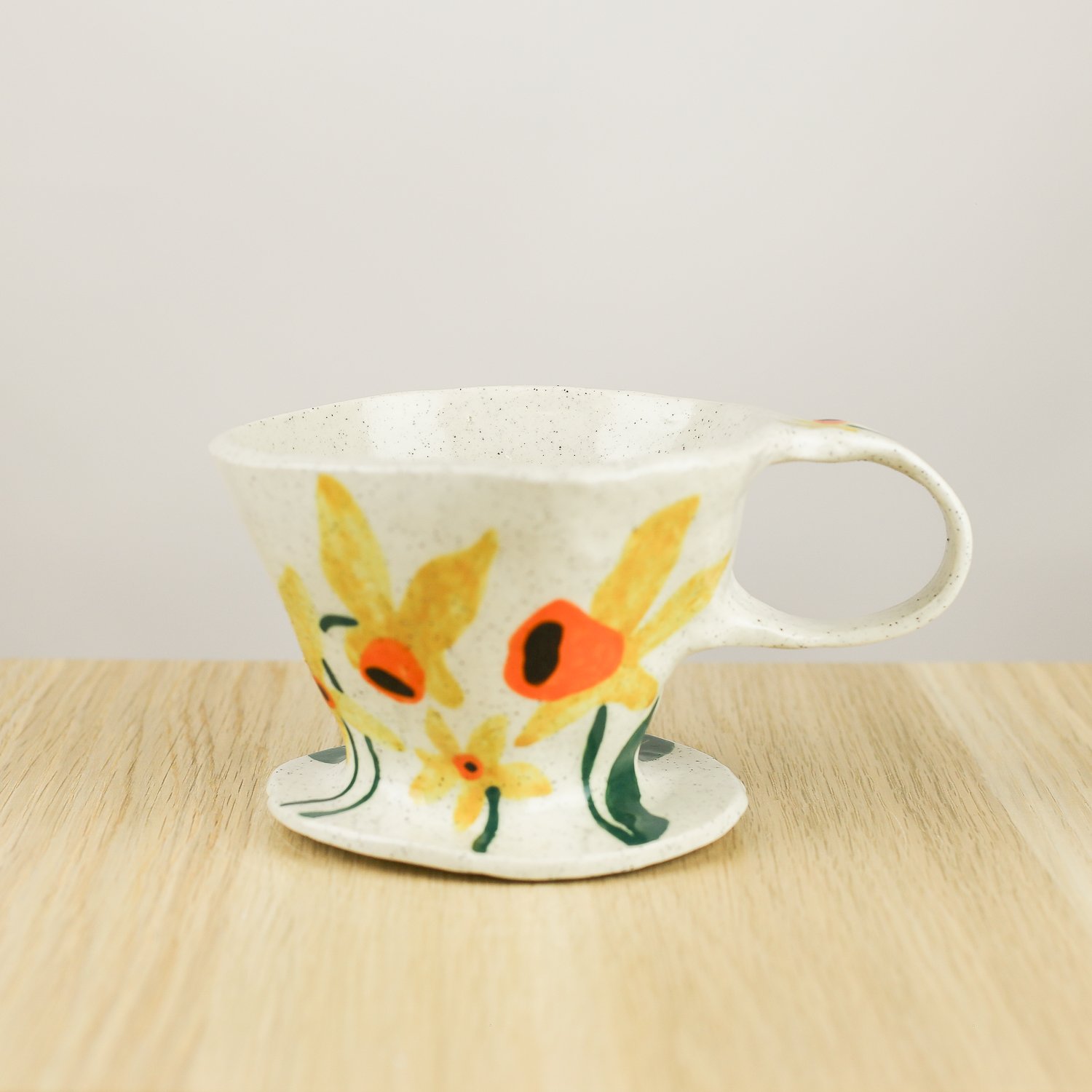 Handmade ceramic coffee dripper with daffodil flowers in yellow and green, pour over coffee maker by hellomae