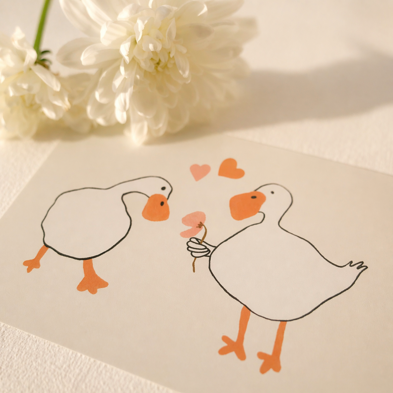 Handmade ceramic strawberry vase with matching strawberry brooch styled together on a soft, light background