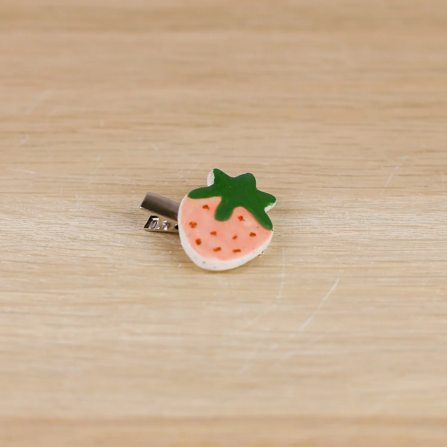 Handmade ceramic strawberry hair clip on silver alligator clip by helllomae