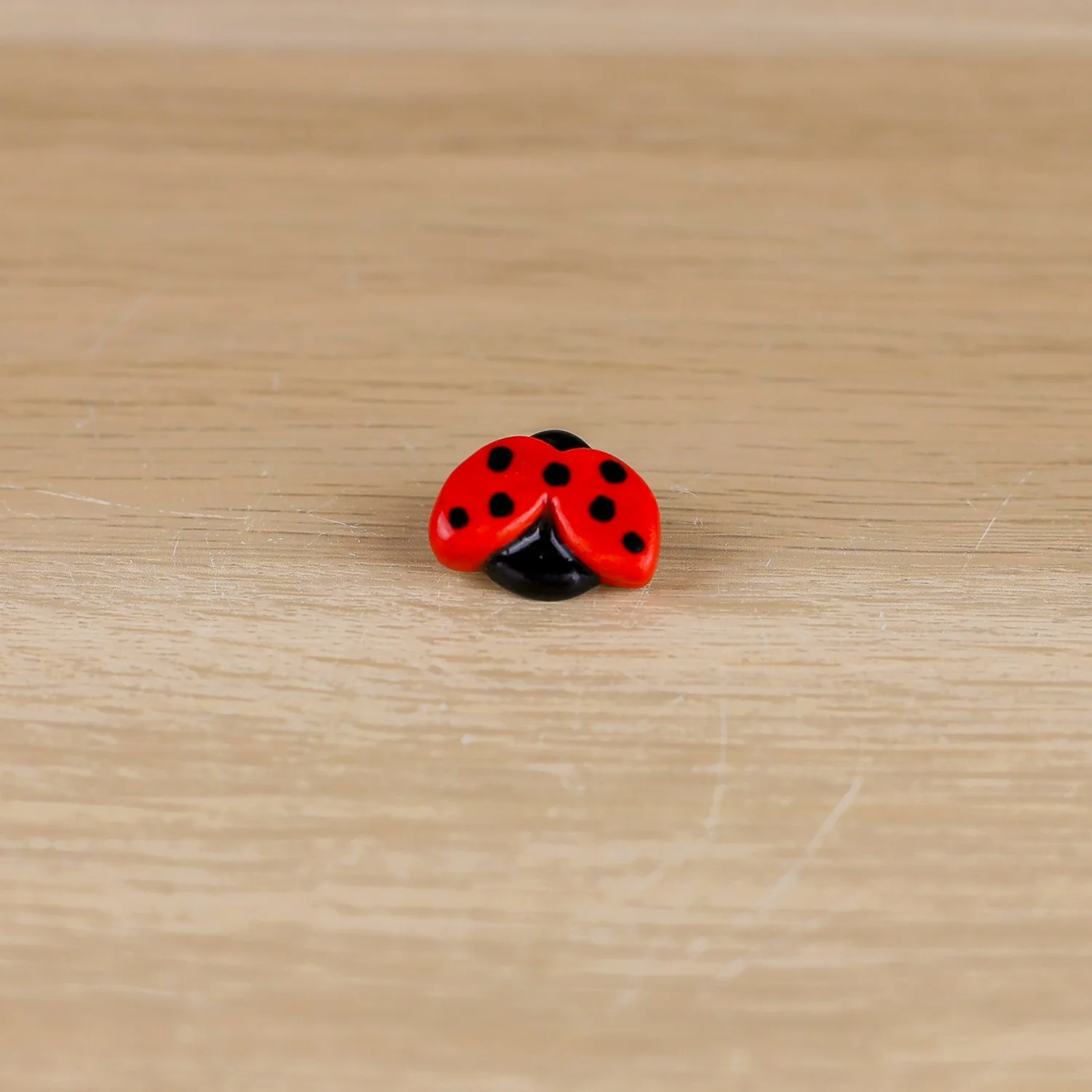 Handmade ceramic ladybug brooch with butterfly clasp backing by hellomae