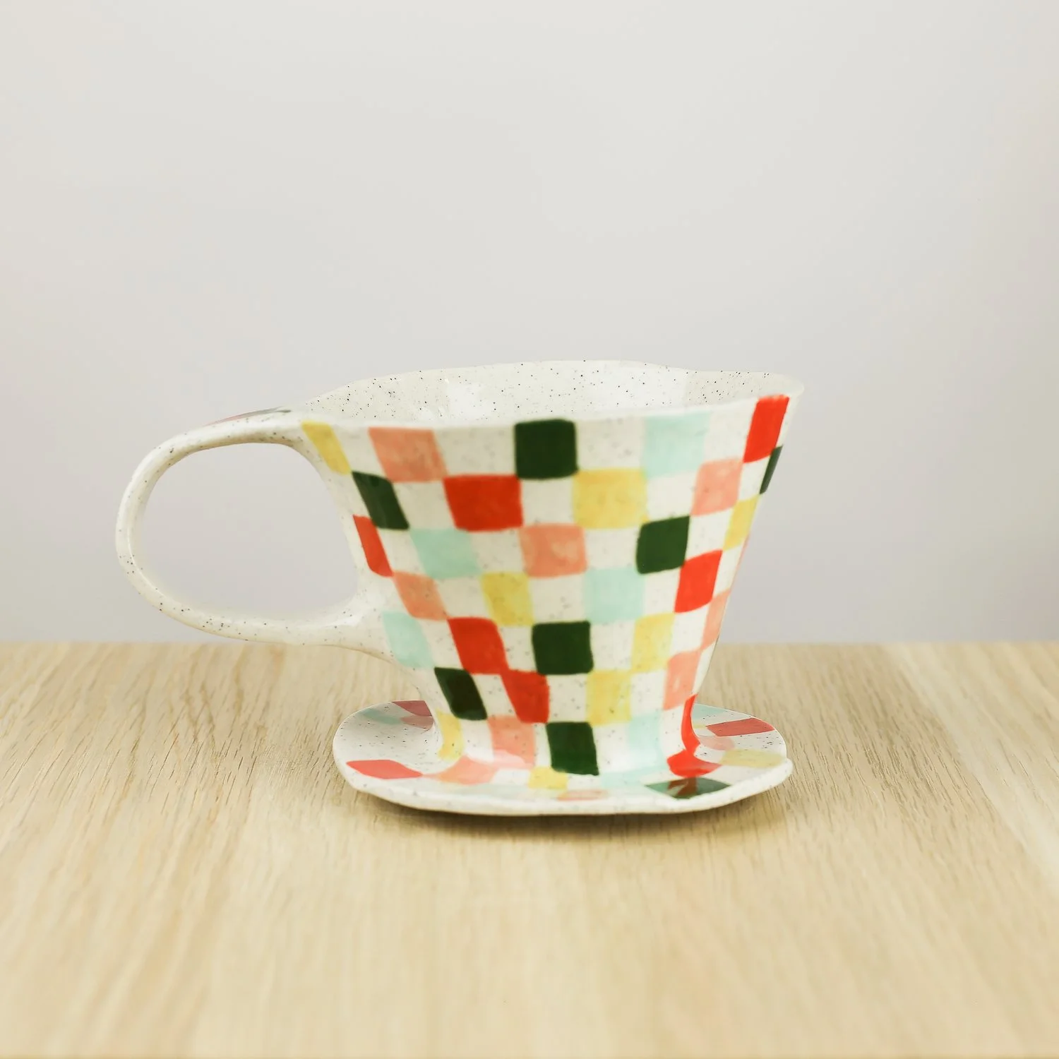 Handmade ceramic coffee dripper with colourful check pattern in red pink yellow and blue, pour over coffee maker by hellomae