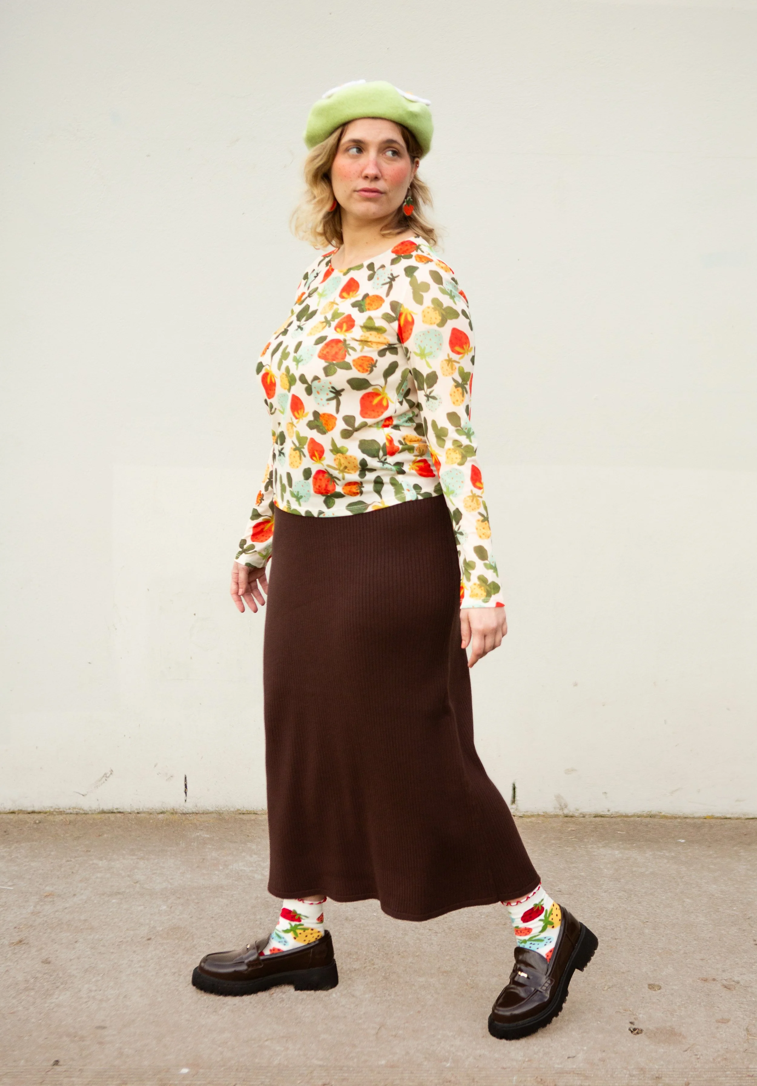 Soft, stretchy mesh top featuring the hand-painted Strawberry Dream print. Made from recycled polyester and ethically produced. Available in sizes 8–20.