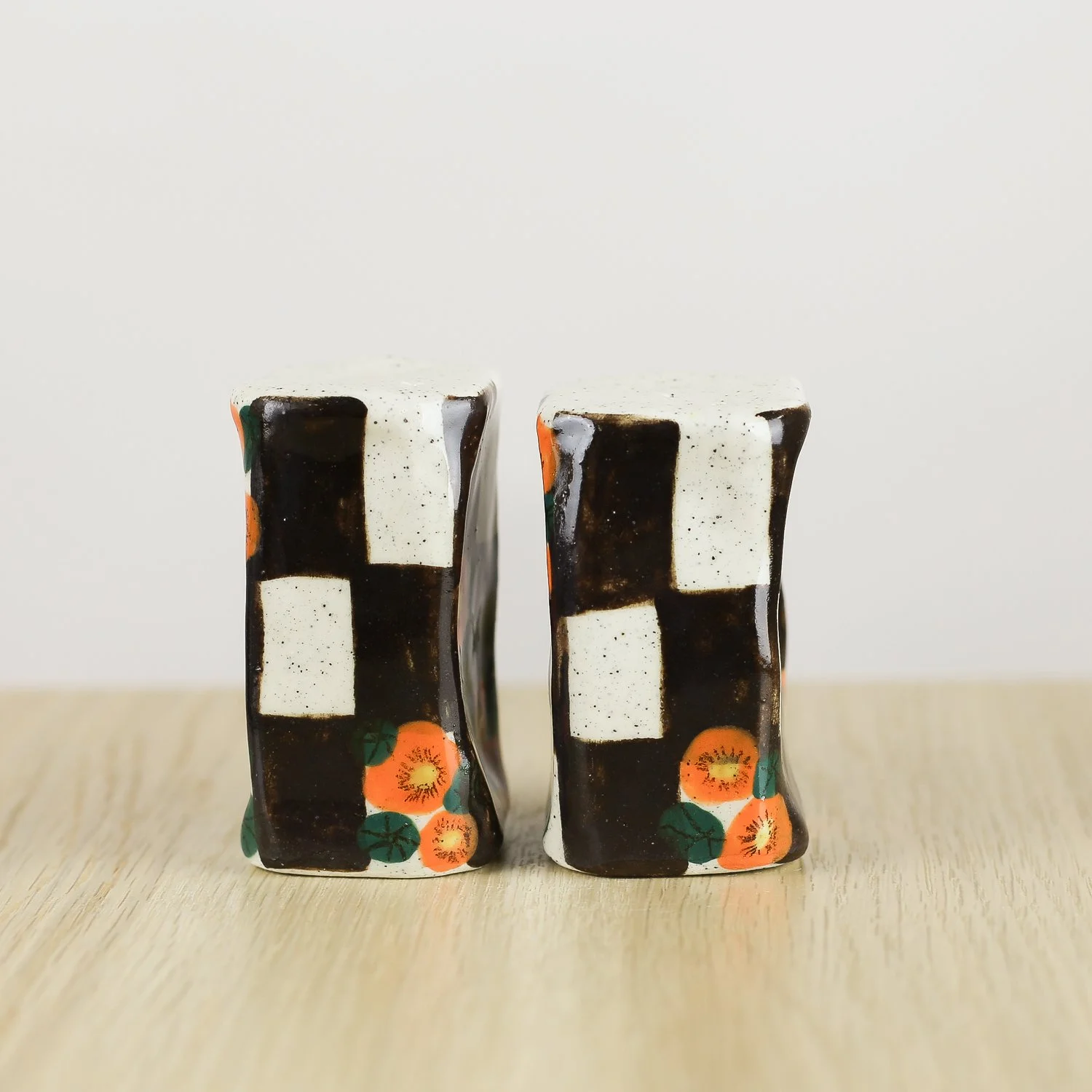 Handmade ceramic salt and pepper shaker set with nasturtium flowers and brown check pattern by hellomae