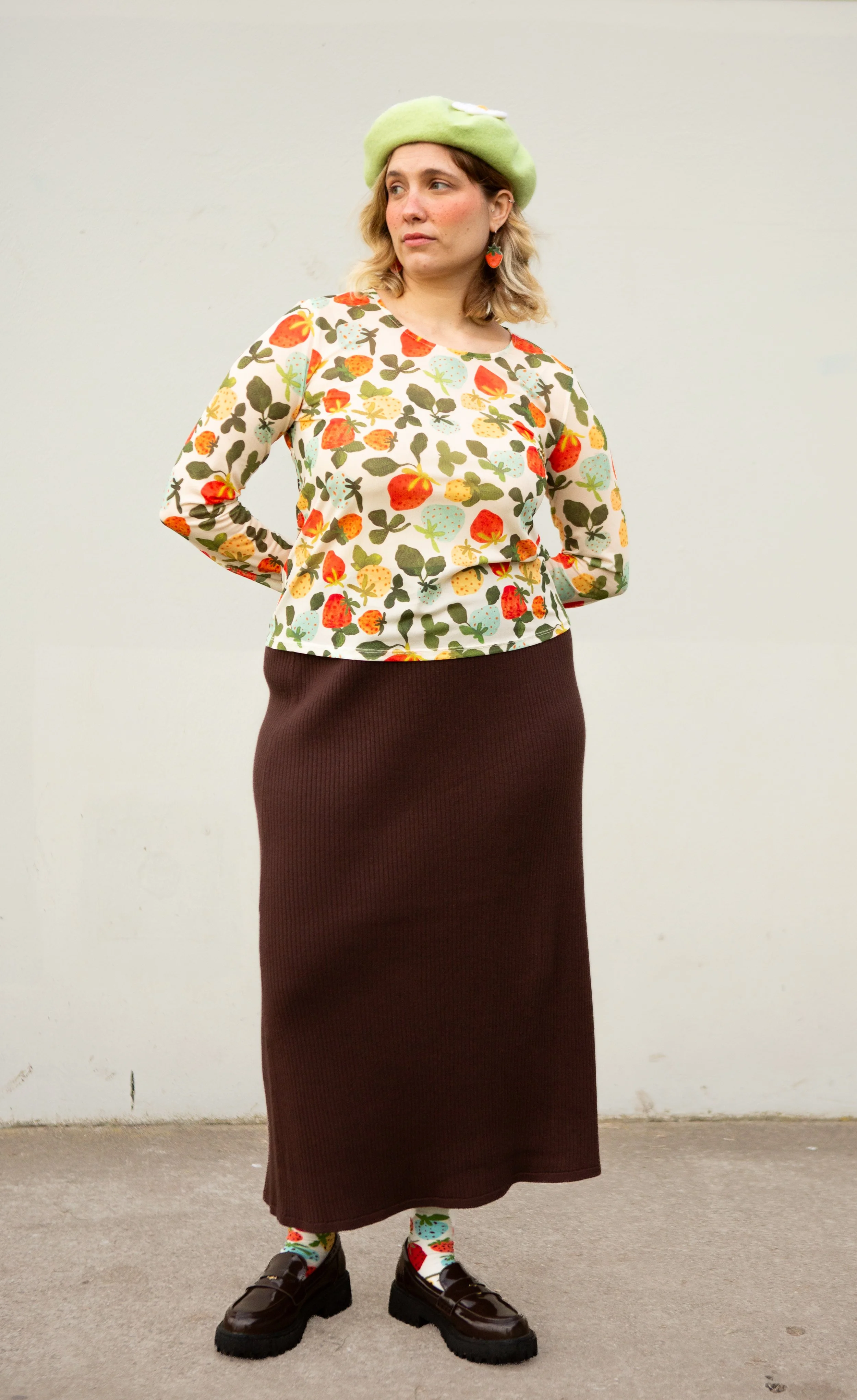 Soft, stretchy mesh top featuring the hand-painted Strawberry Dream print. Made from recycled polyester and ethically produced. Available in sizes 8–20.