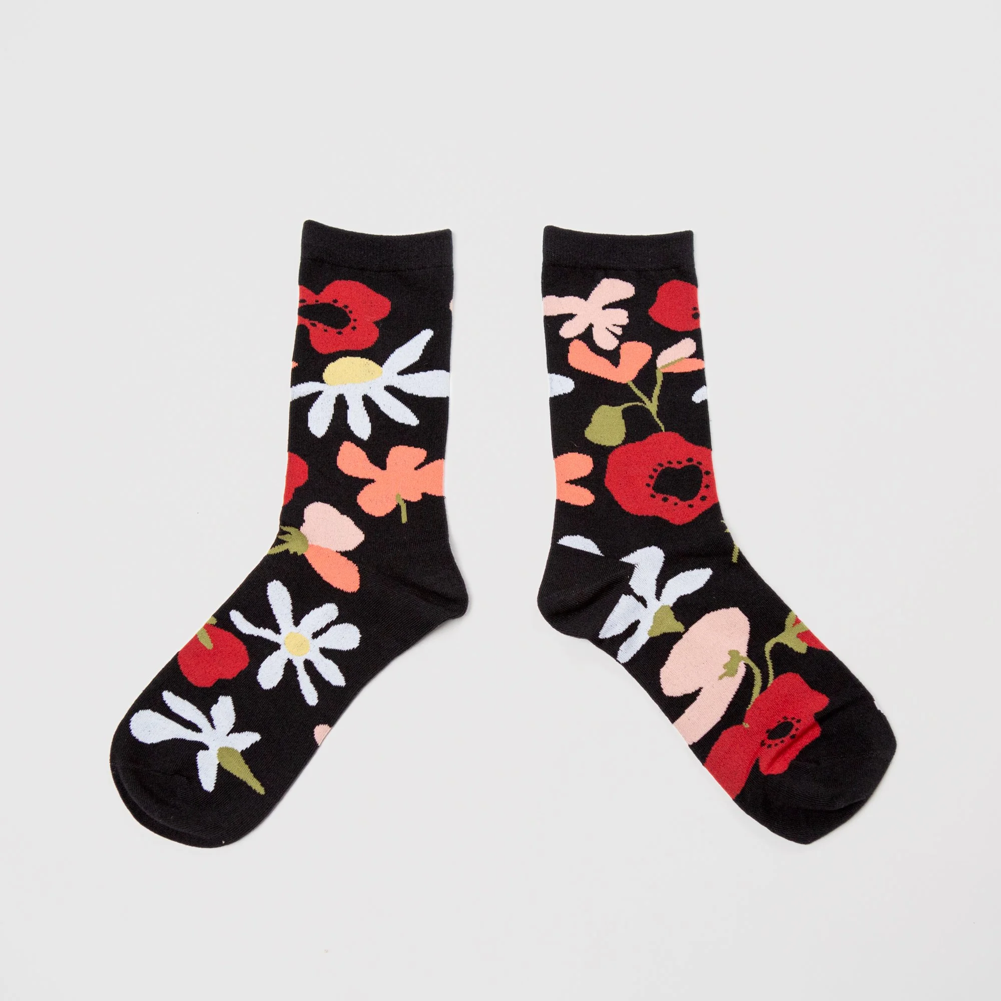 Soft crew socks featuring the hand-painted Flower Daze print. Comfortable, colourful and perfect for adding a playful touch to your everyday wardrobe.