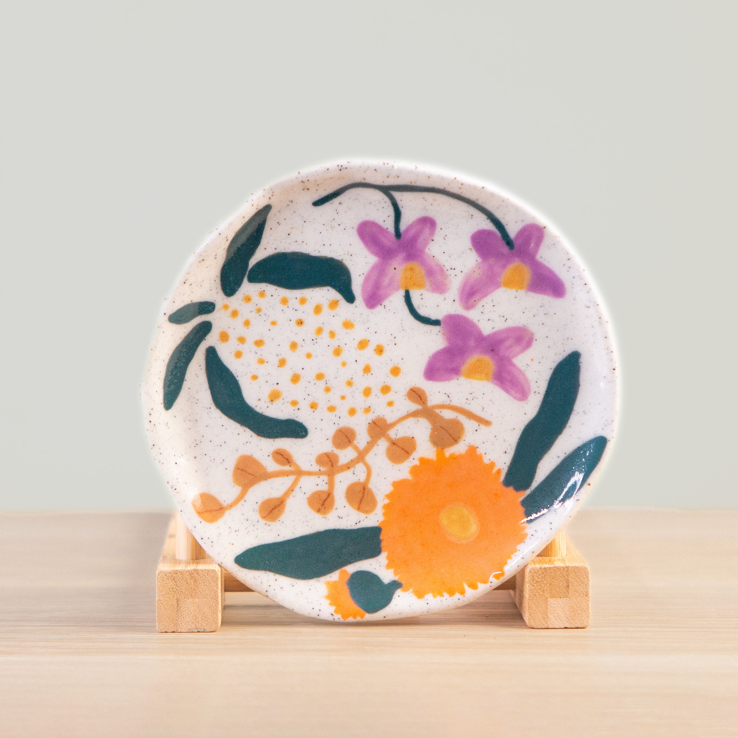 Ceramic saucer/mini plate, hand made and hand painted with Australian native flowers