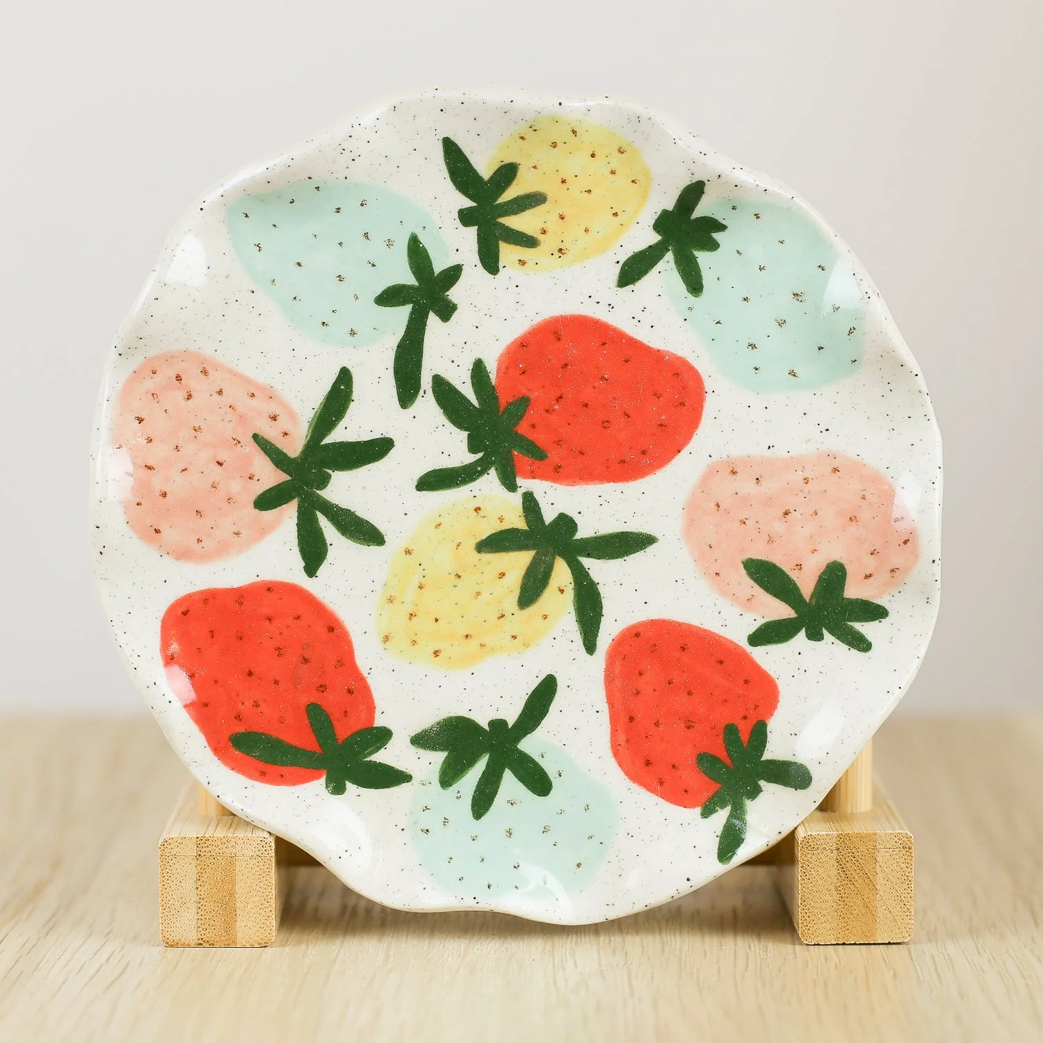 Handmade ceramic saucer with hand-painted strawberries, 13.5cm small plate for snacks or jewellery by Hello Mae