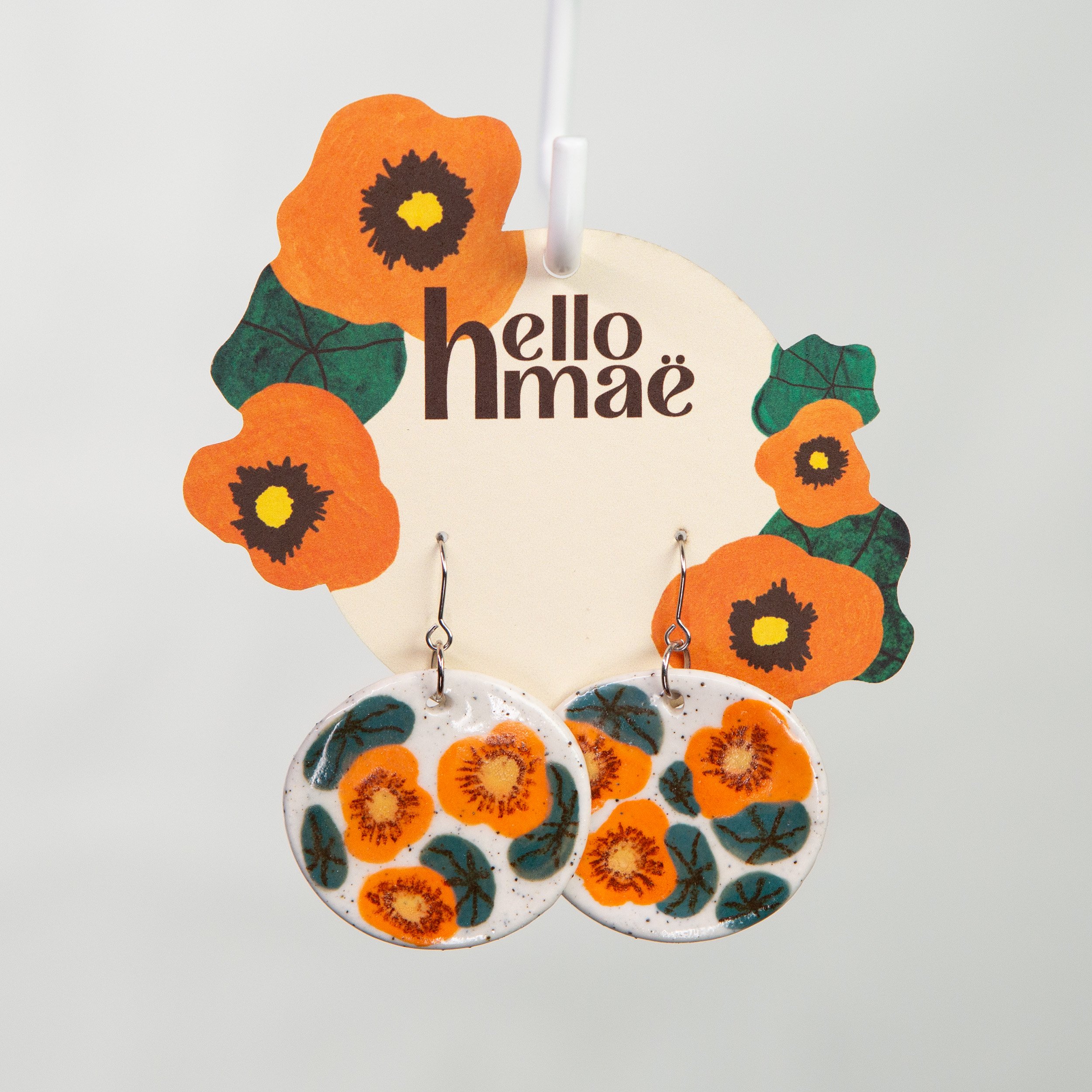 Handpainted nasturtium flowers on white speckle ceramic earrings
