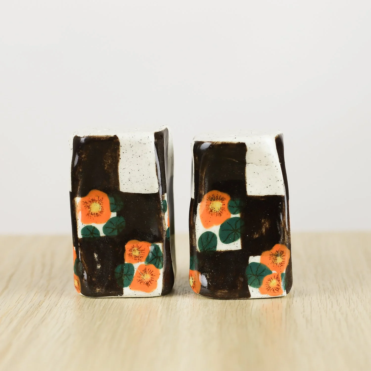 Handmade ceramic salt and pepper shaker set with nasturtium flowers and brown check pattern by hellomae