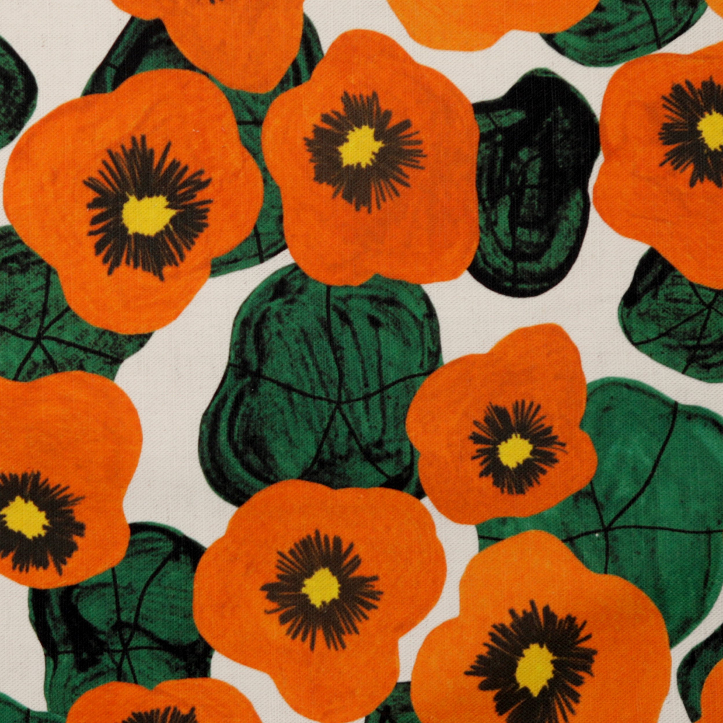 Cotton linen tote bag with a hand-drawn nasturtium print, hanging on a wall. Soft, structured, and made in Melbourne.