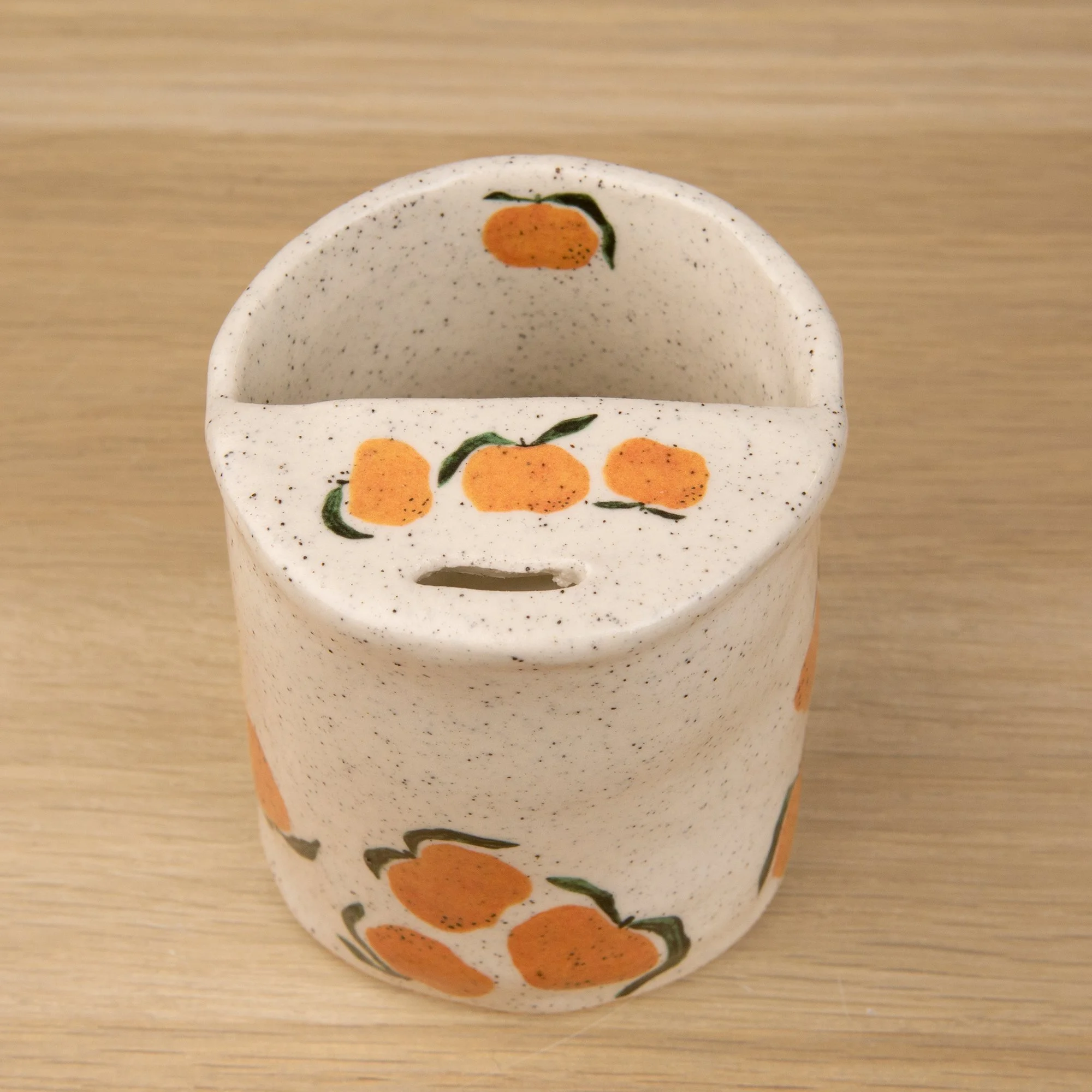 Handmade speckled ceramic mandarin travel cup decorated with sweet mandarin illustrations