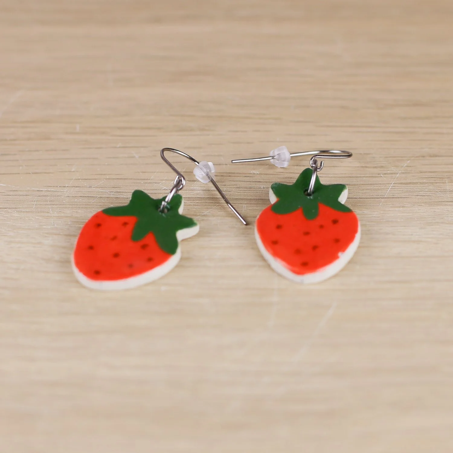 Handmade ceramic strawberry drop earrings in red with stainless steel hooks by hellomae