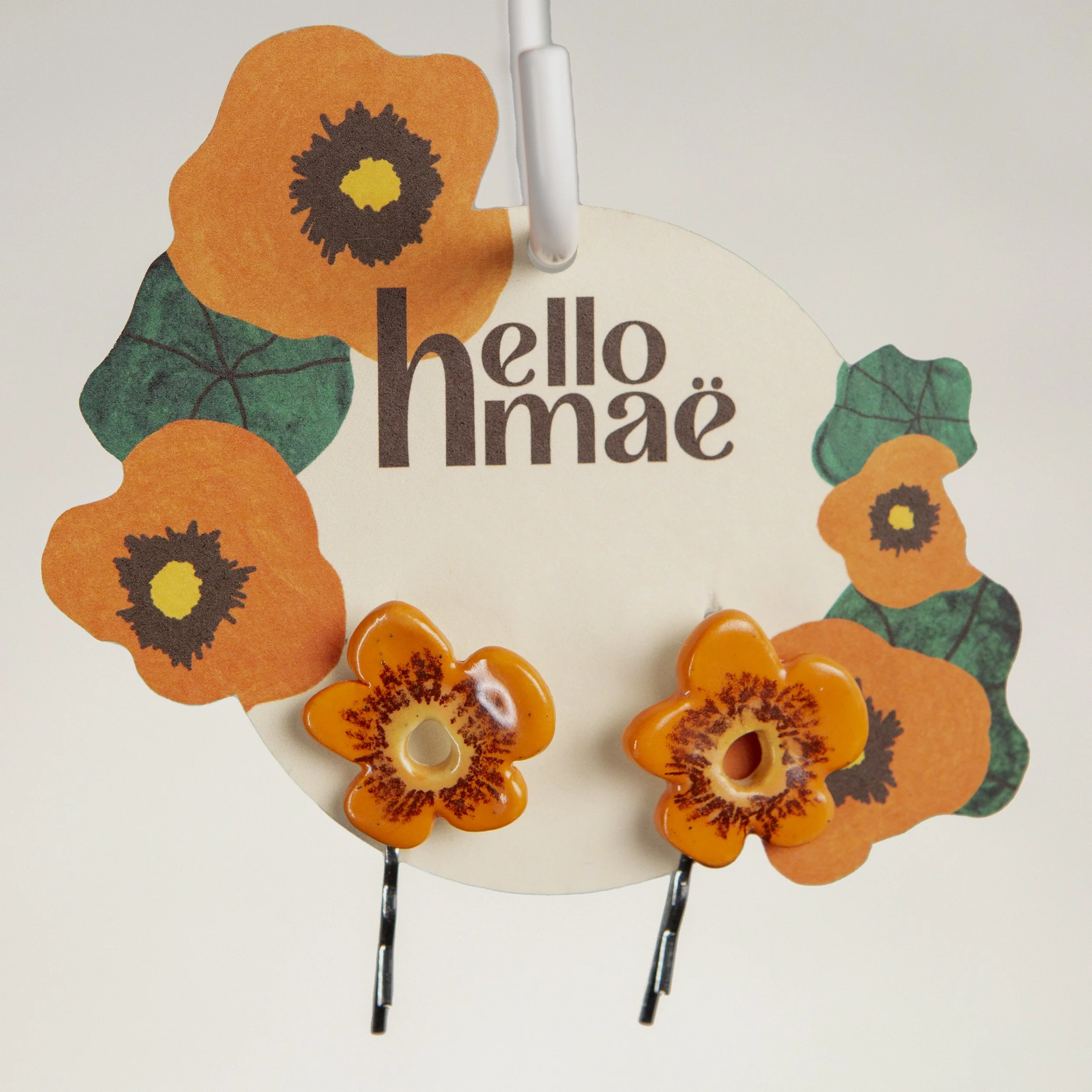 A set of two ceramic hair pins – 2 orange flowers, handmade and painted.