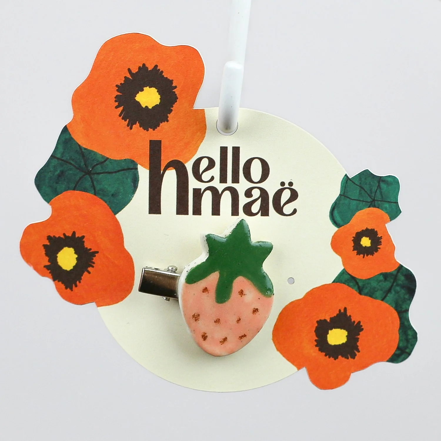 Handmade ceramic strawberry hair clip on silver alligator clip by helllomae