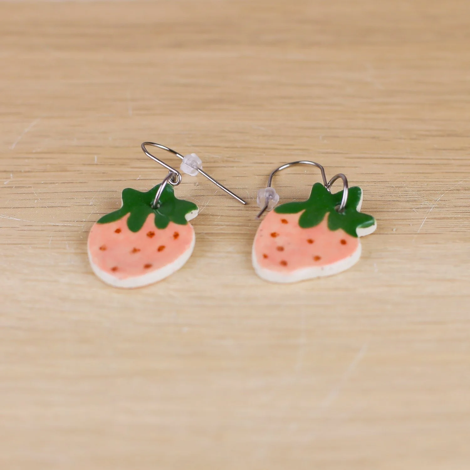 Handmade ceramic strawberry drop earrings in pink with stainless steel hooks by hellomae