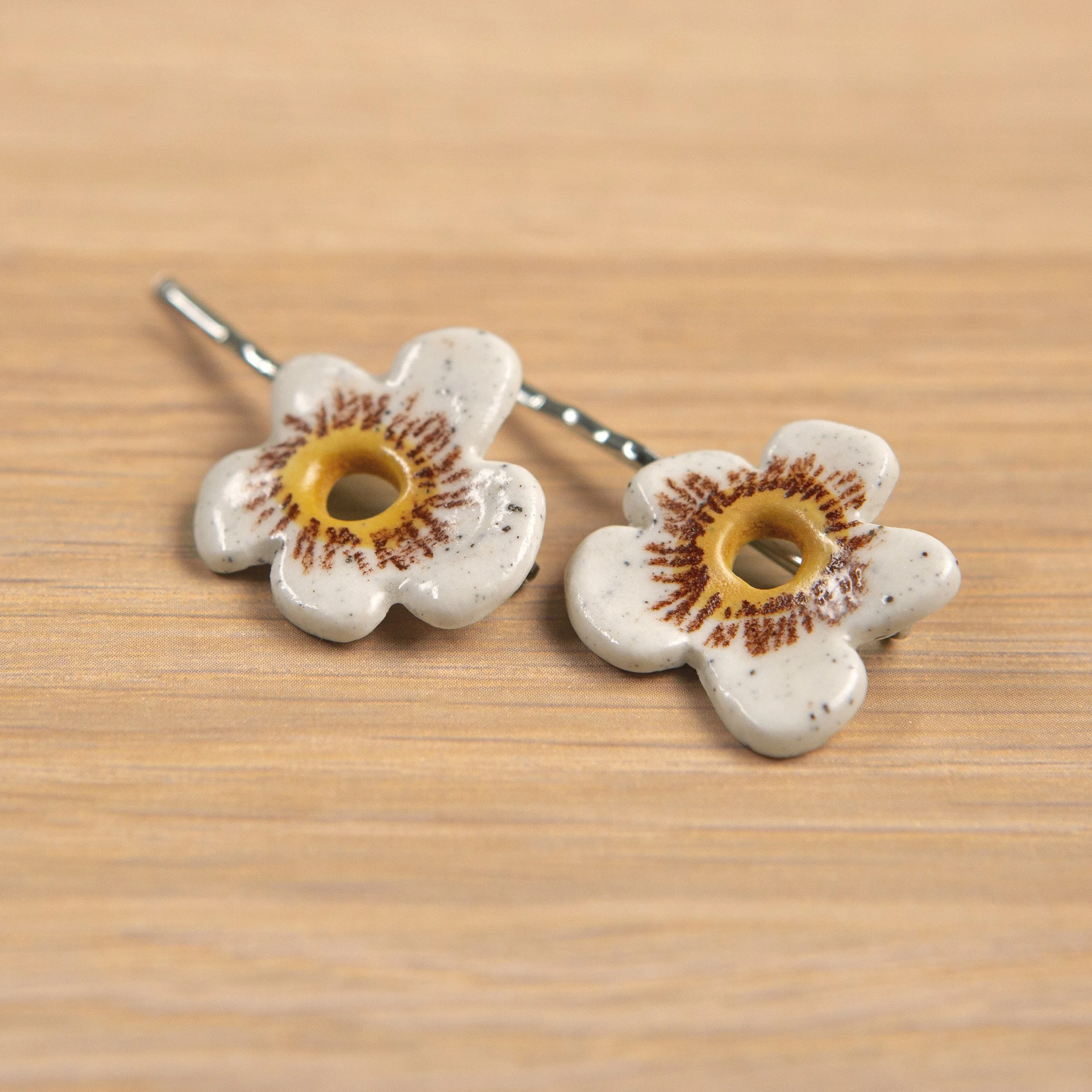 A set of two ceramic hair pins – 2 white flowers, handmade and painted.