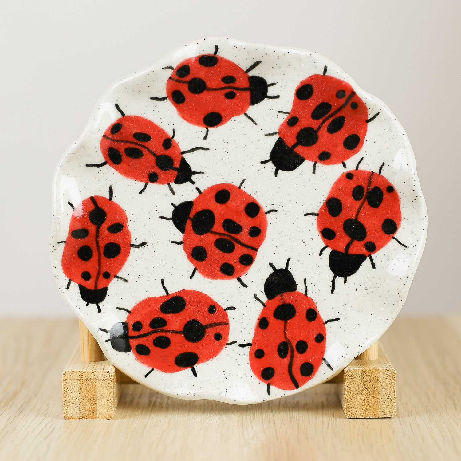 Handmade ceramic saucer with hand-painted ladybugs, 13.5cm small plate or jewellery dish by Hello Mae