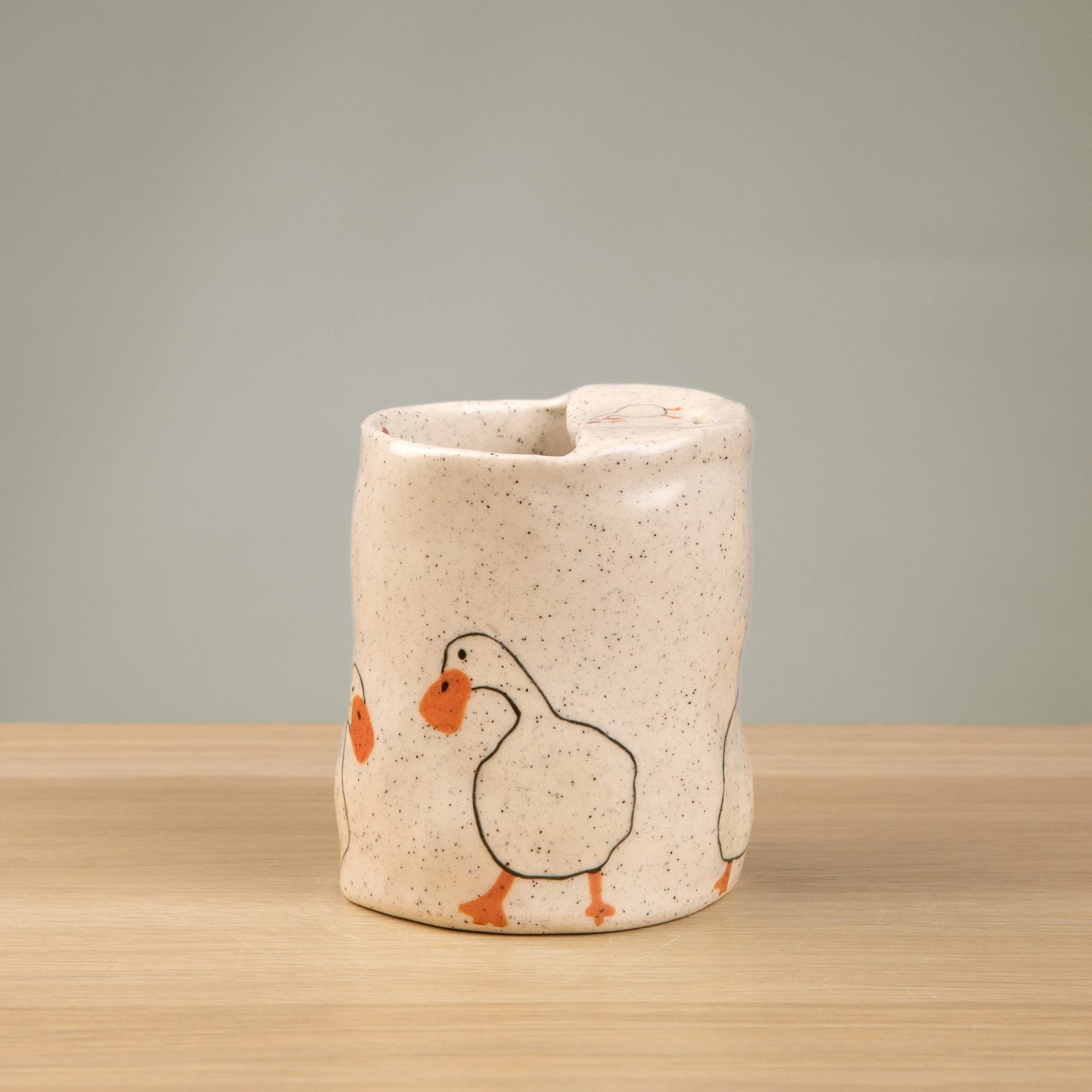 Handmade speckled ceramic loving duck travel cup decorated with cute duck illustrations