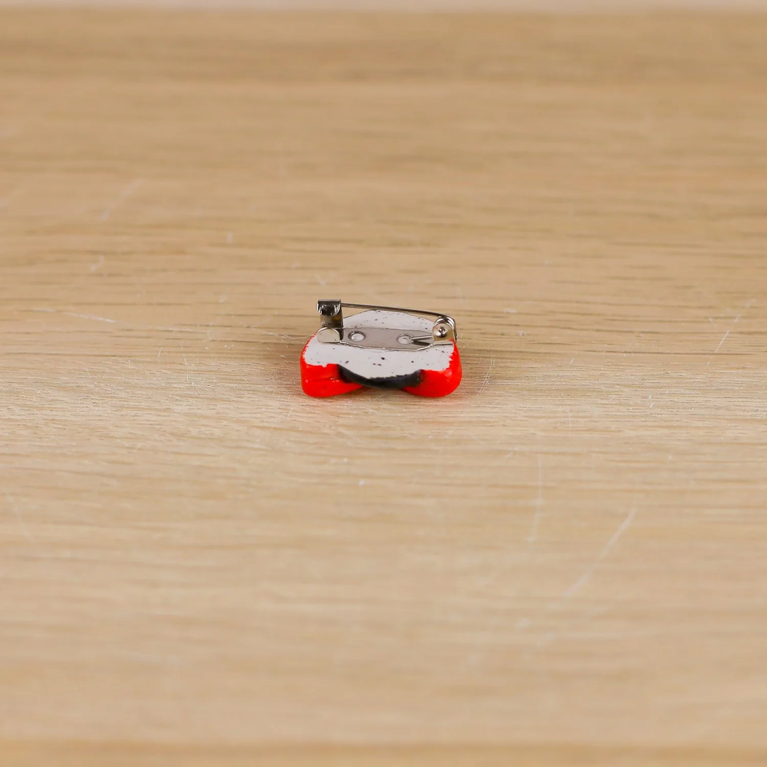 Handmade ceramic ladybug brooch with butterfly clasp backing by hellomae