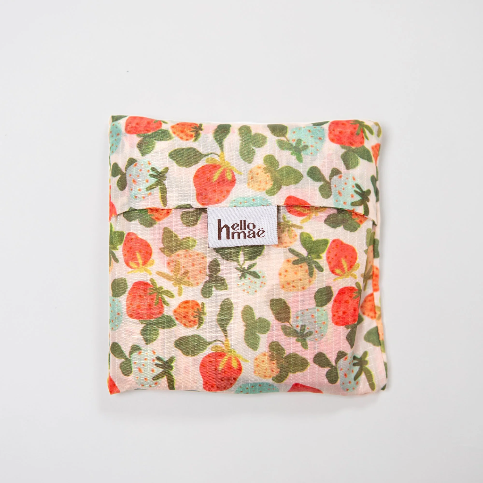Lightweight foldable shopping bag made from recycled PET, featuring the hand-painted Strawberry Dream print. Folds into an 11 × 11 cm pocket for easy everyday use.