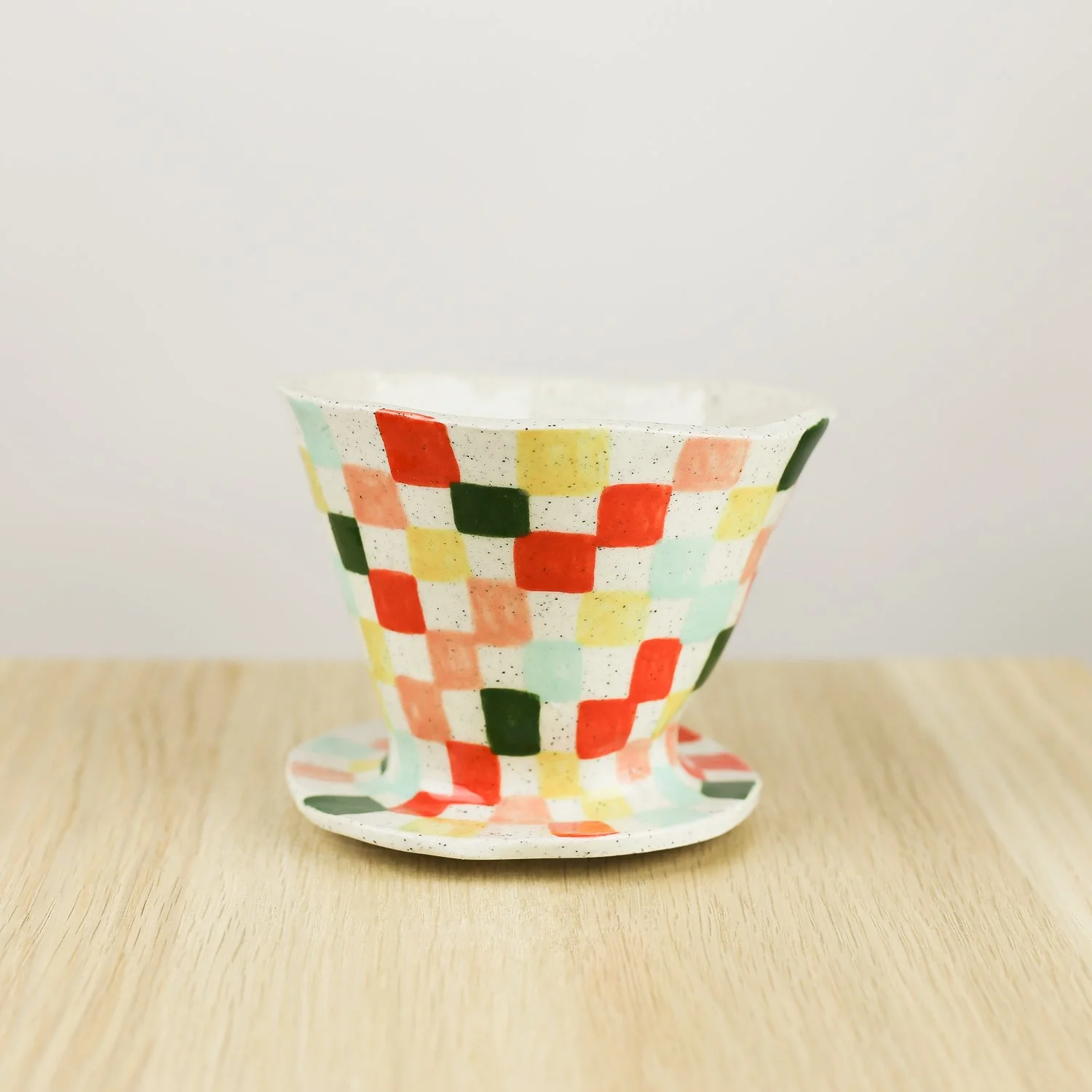 Handmade ceramic coffee dripper with colourful check pattern in red pink yellow and blue, pour over coffee maker by hellomae