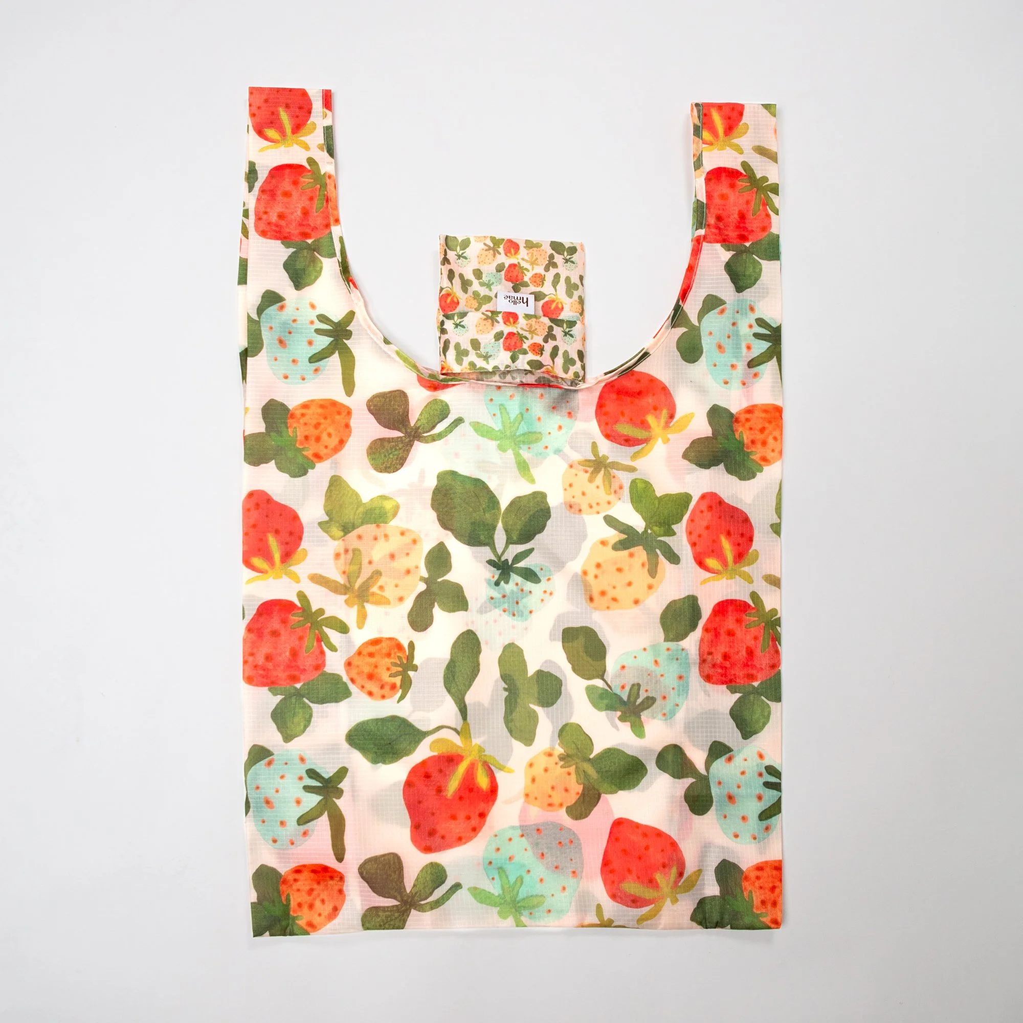 Lightweight foldable shopping bag made from recycled PET, featuring the hand-painted Strawberry Dream print. Folds into an 11 × 11 cm pocket for easy everyday use.