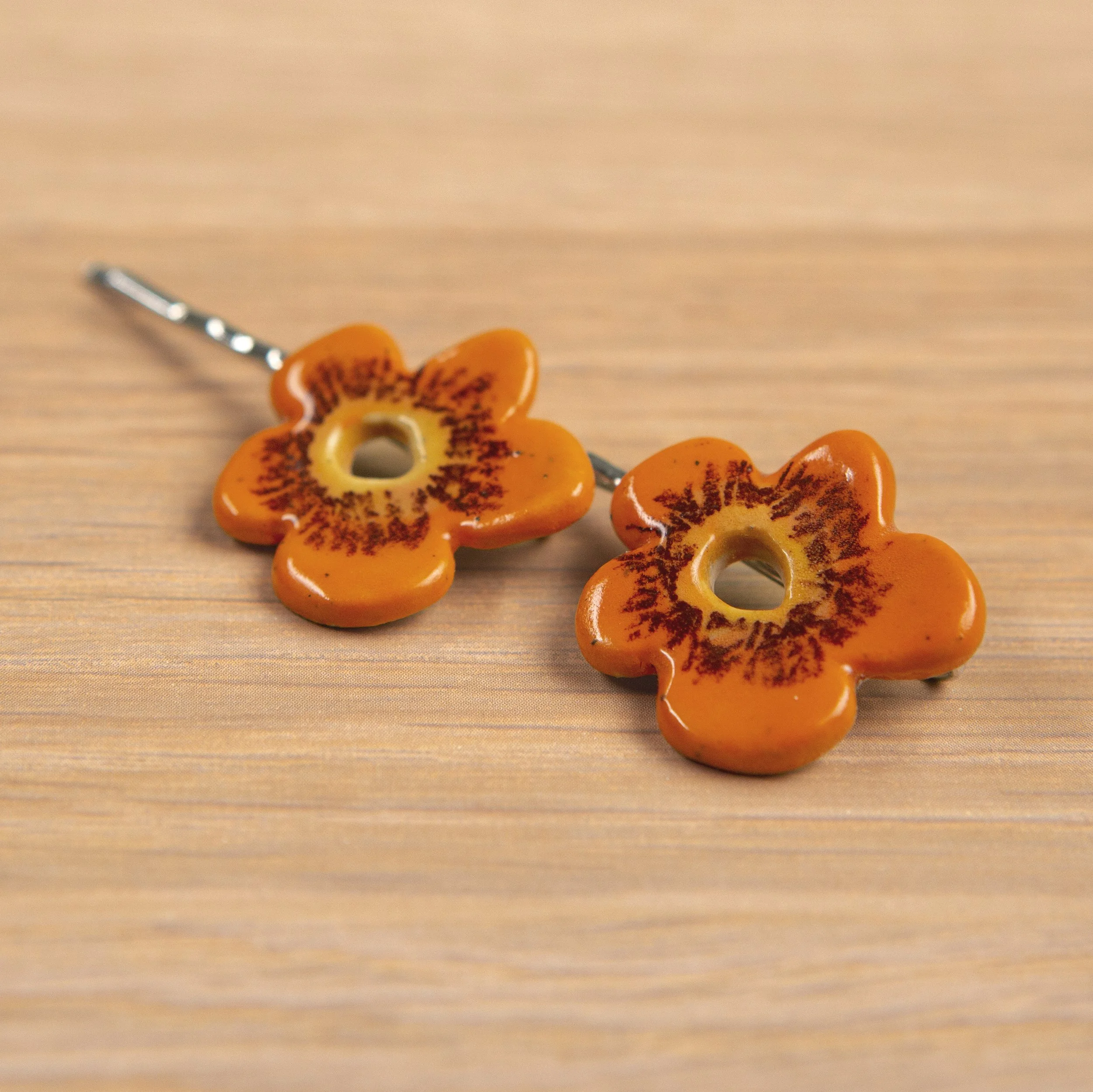 A set of two ceramic hair pins – 2 orange flowers, handmade and painted.