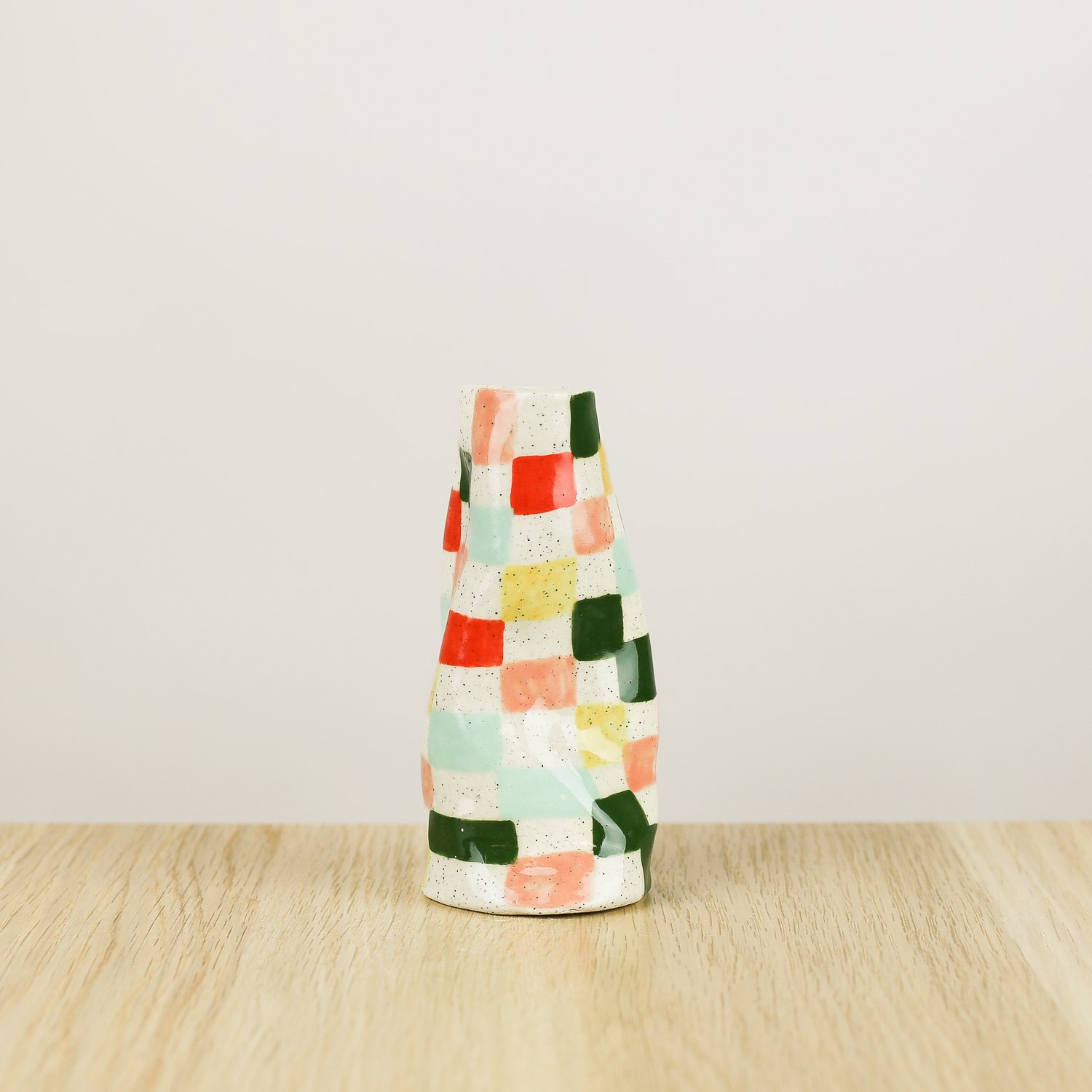 Handmade ceramic mini vase with colourful check pattern in red pink yellow and blue, bud vase by hellomae