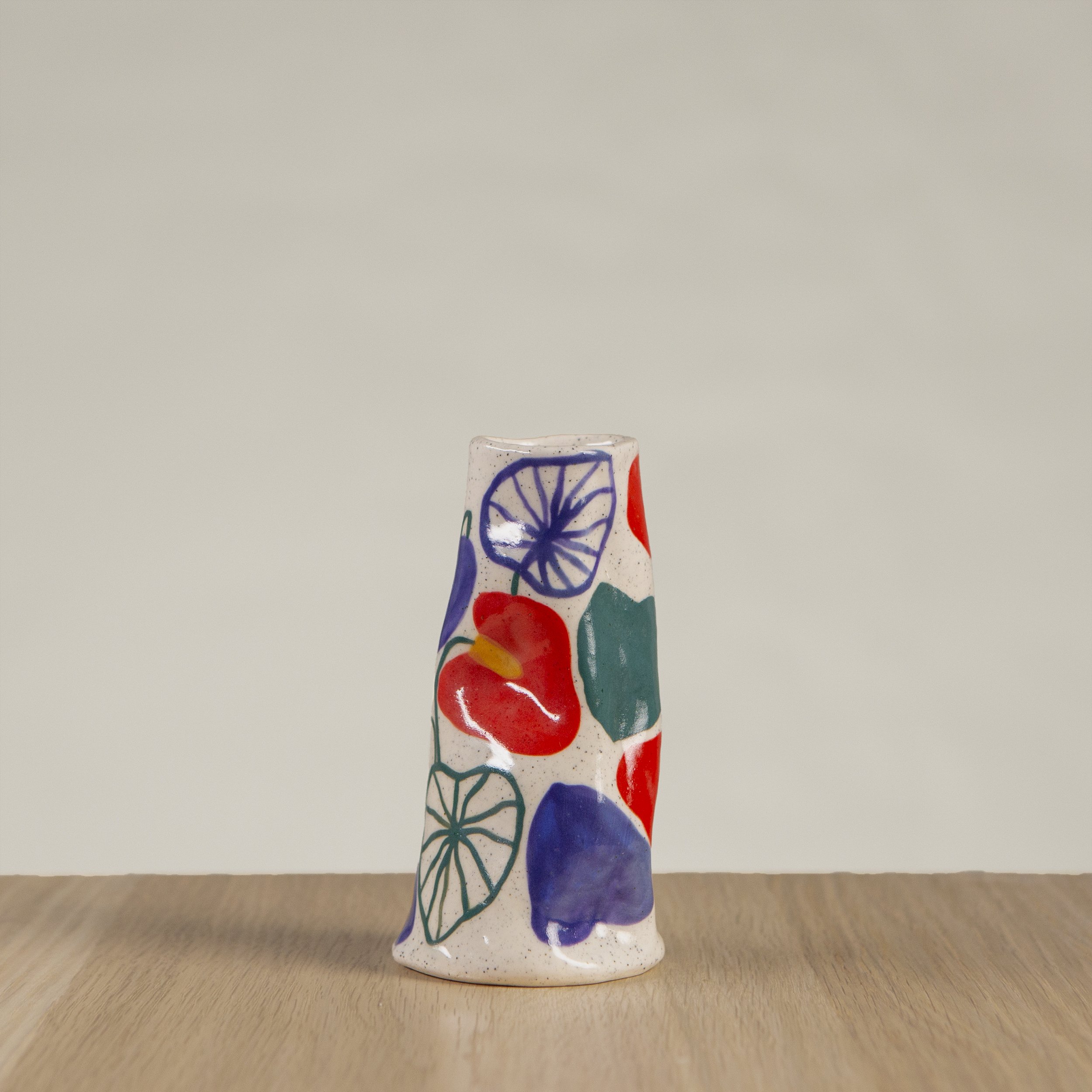 Mini ceramic vase with hand-painted anthurium flower artwork on speckled clay, handmade in Melbourne by hellomaë
