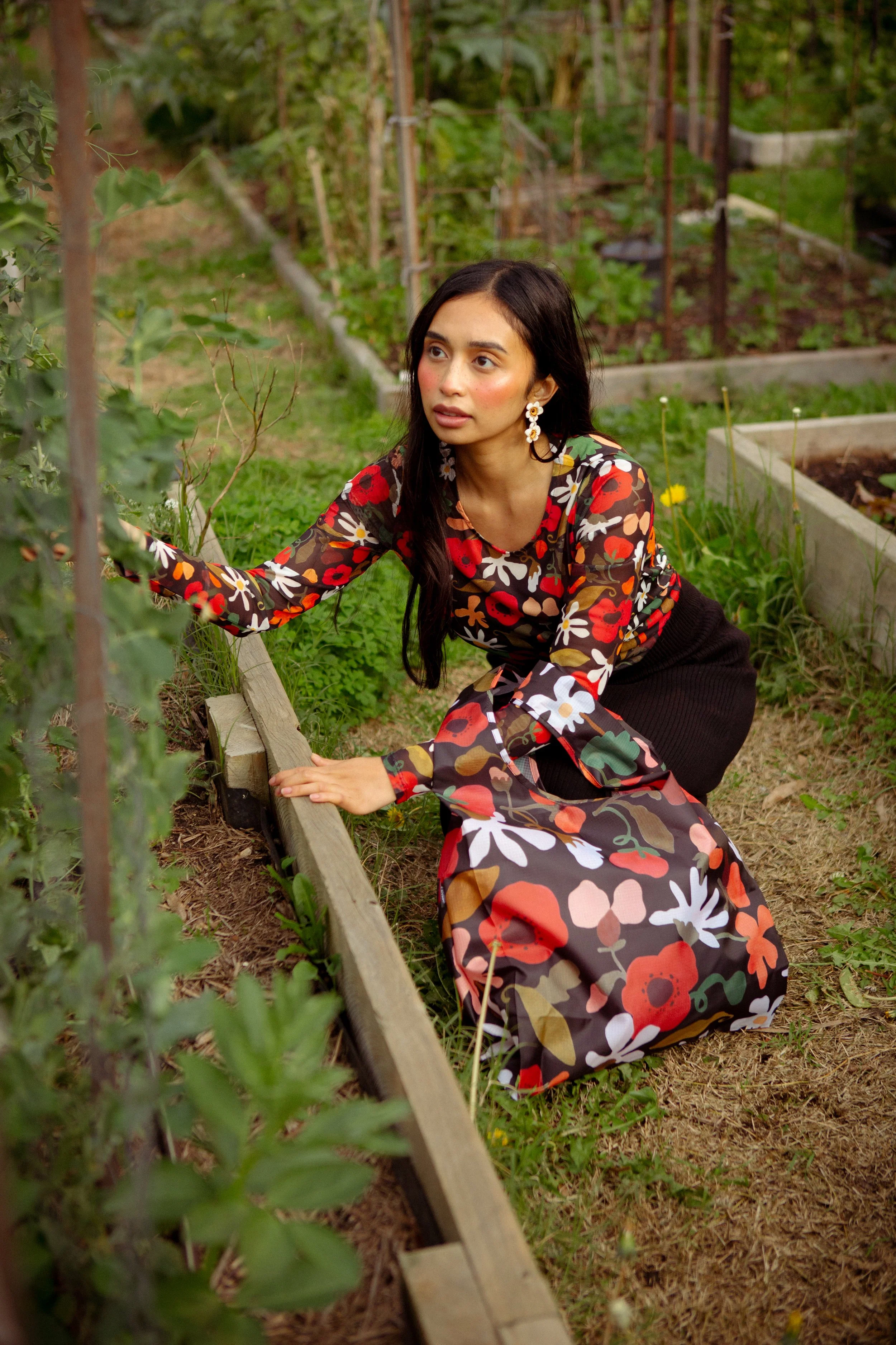 Soft, stretchy mesh top featuring the hand-painted Flower Daze print. Made from recycled polyester and ethically produced. Available in sizes 8–20.