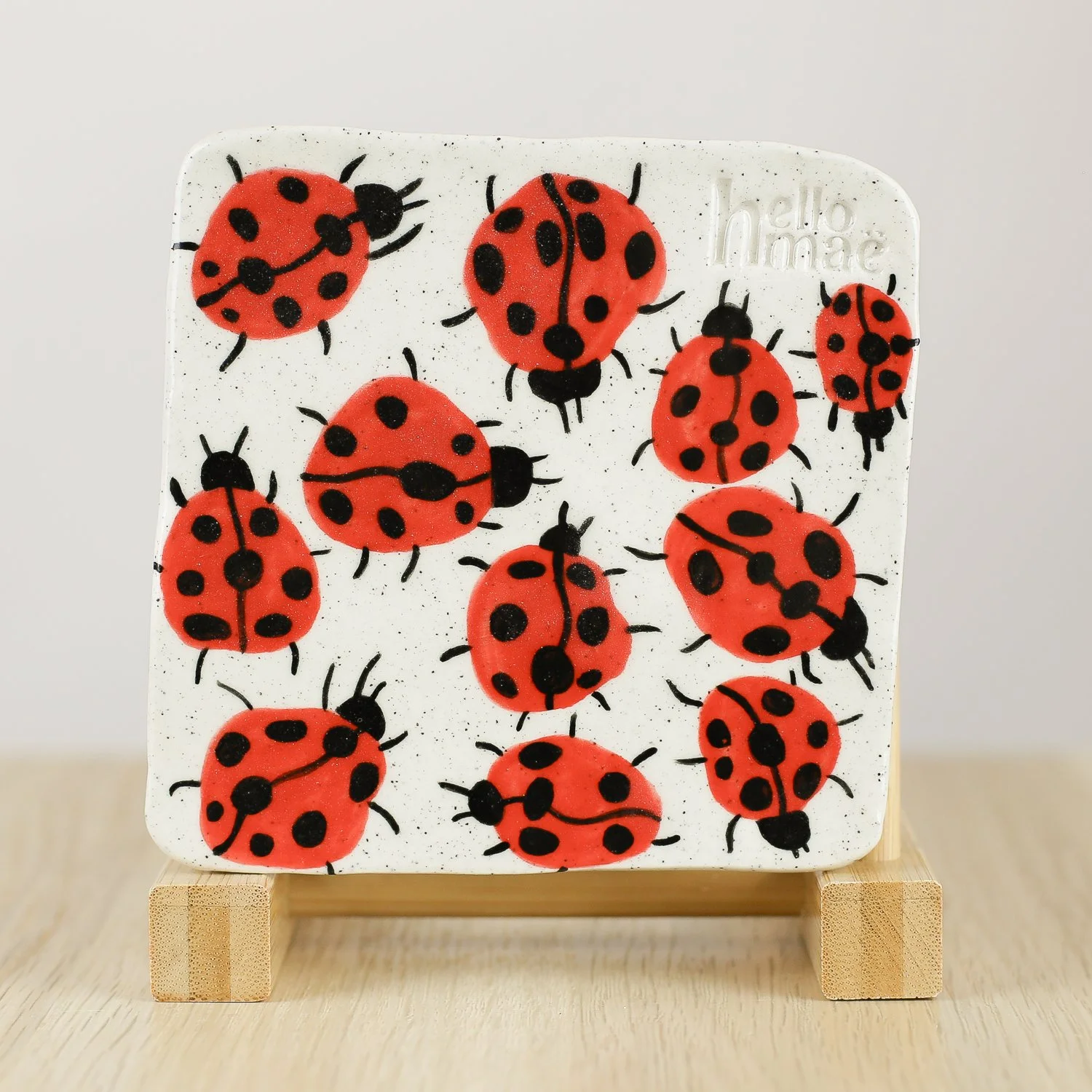 Handmade ceramic coaster with hand-painted ladybugs and cork backing, 11cm by hellomae