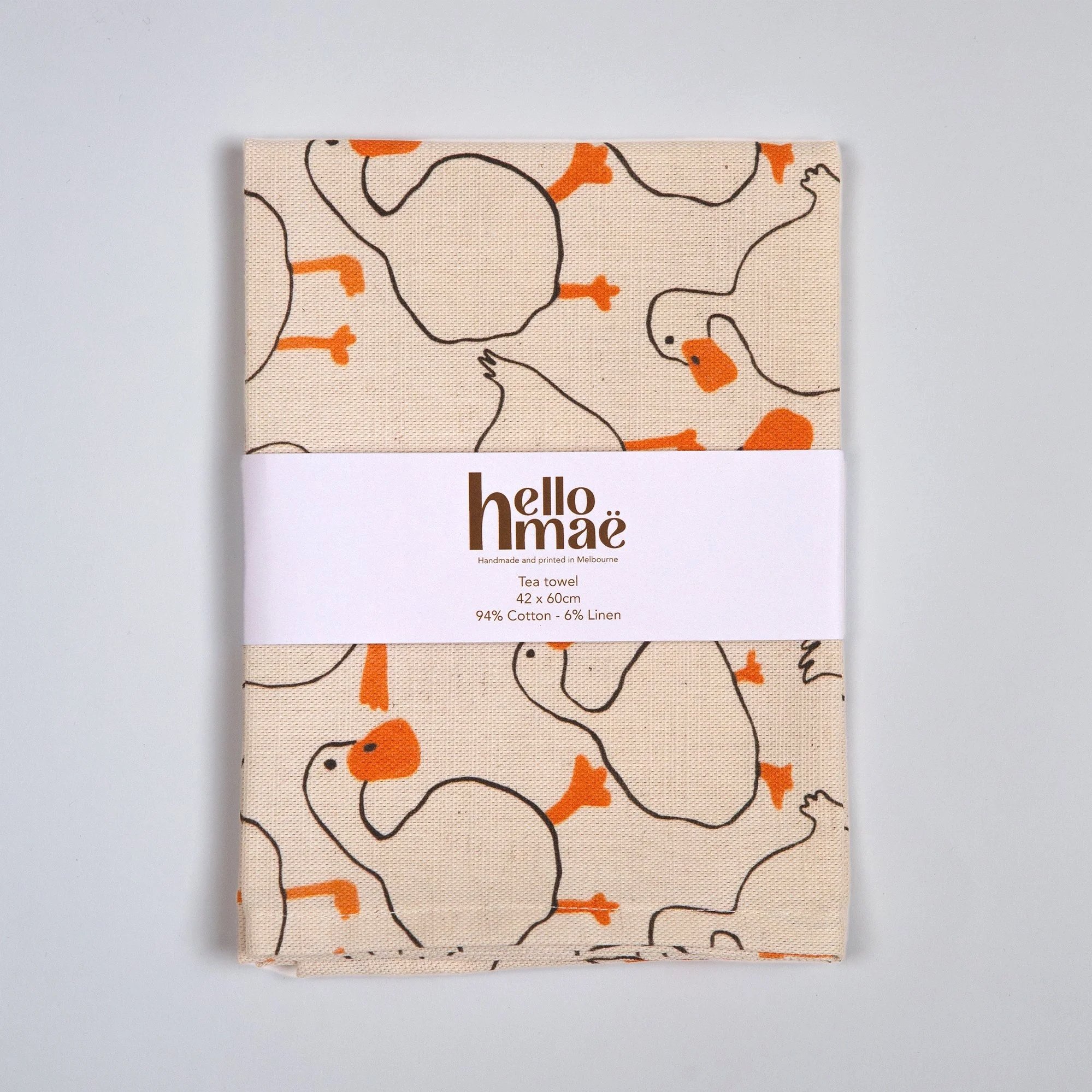 Colourful duck tea towel featuring a playful print of hand-drawn ducks and garden-inspired details.
