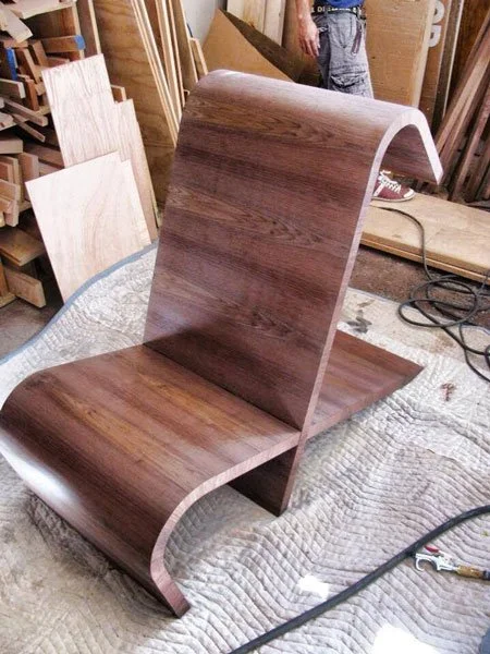 Walnut curved lounge chair, designed by Eric Fader Designs
