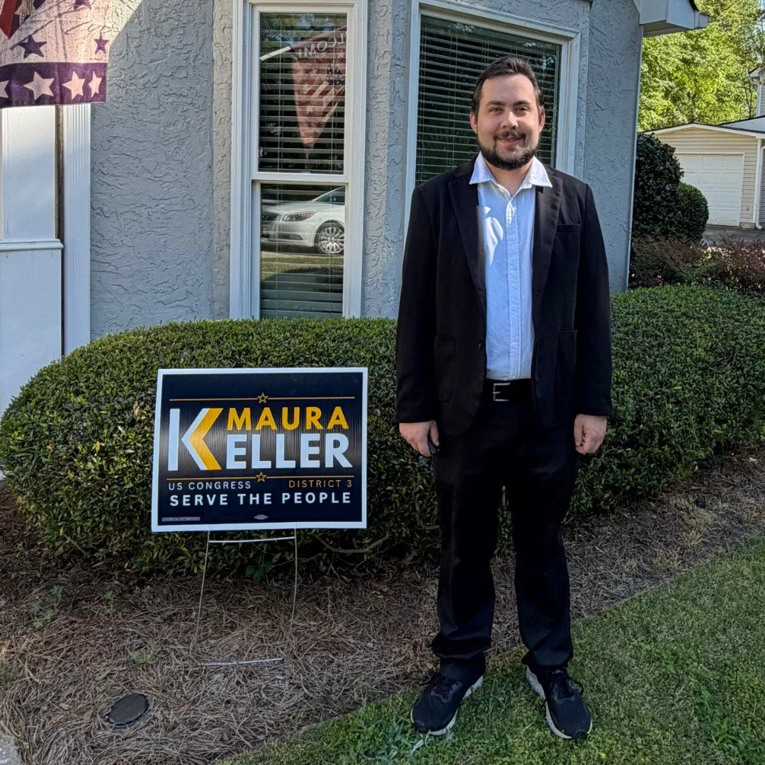 Maura Keller for Congress supporter with yard sign