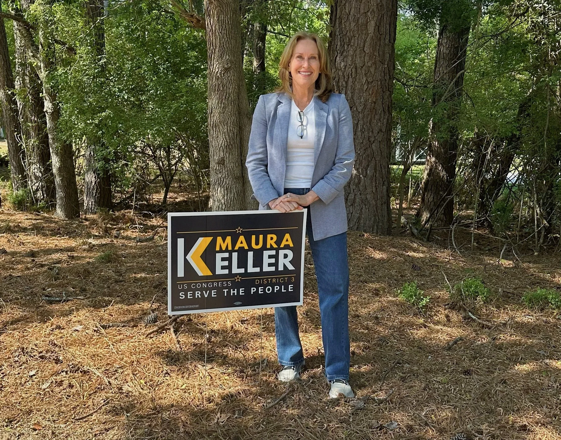 Maura Keller with her yard sign.