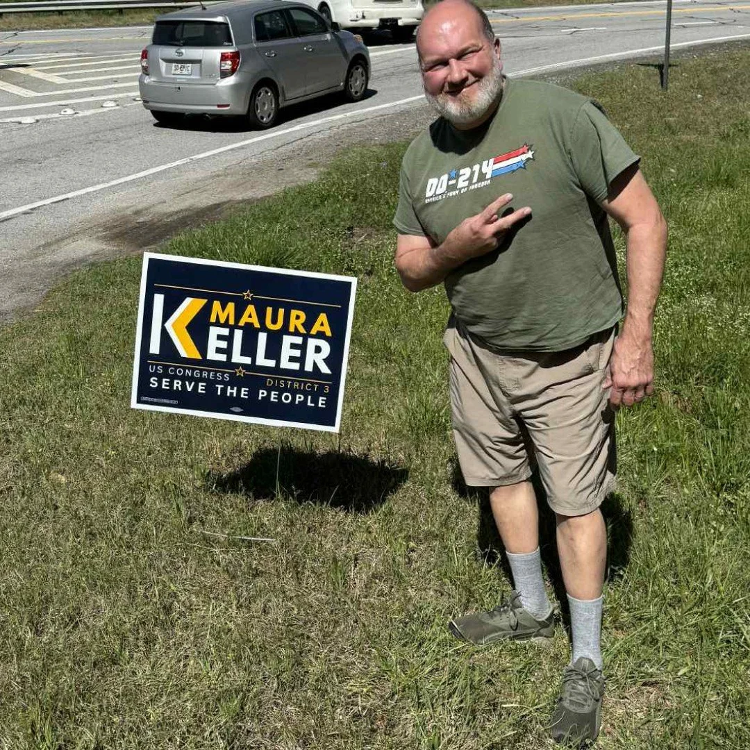 Maura Keller for Congress supporter with yard sign