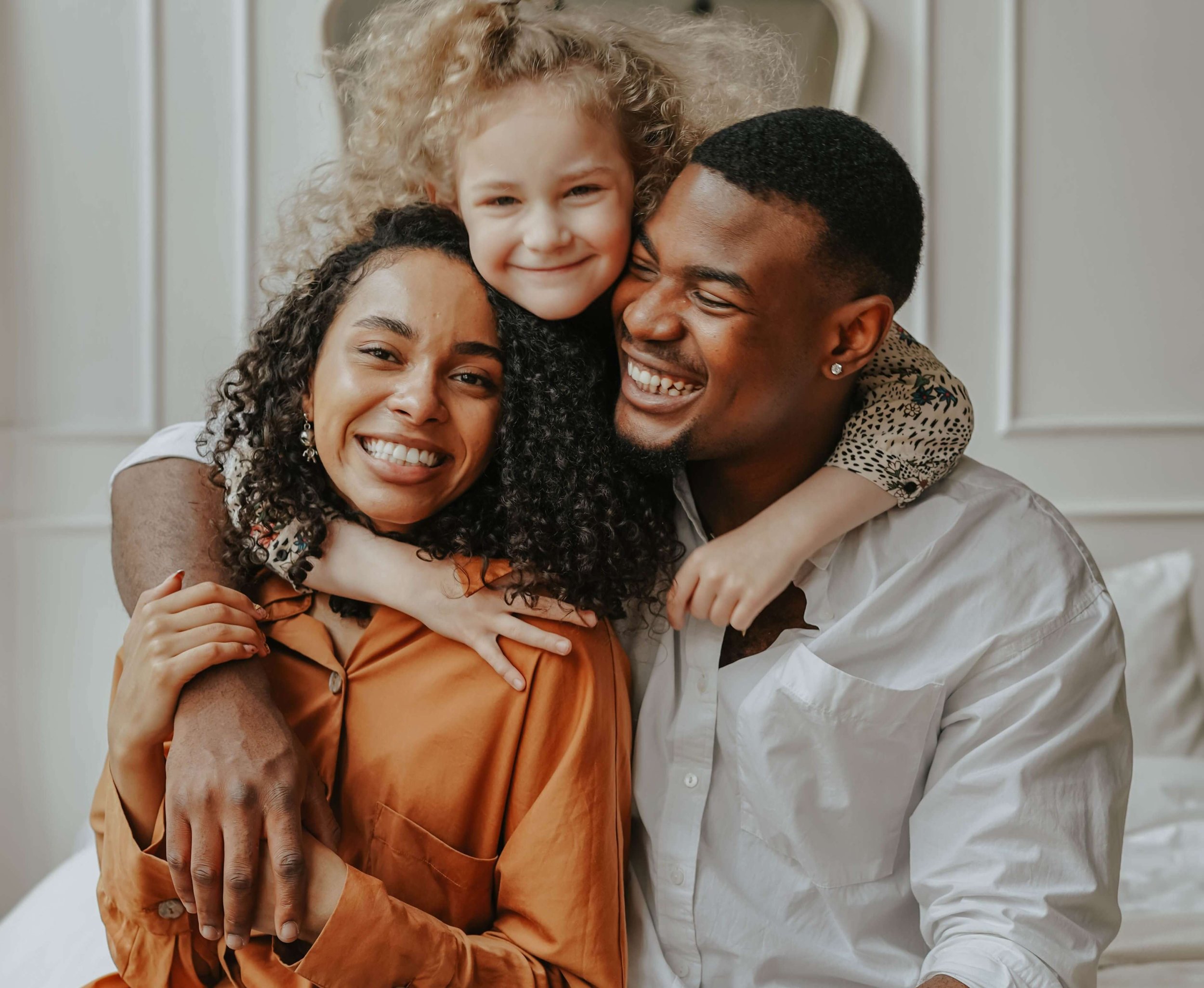 Two parents smile warmly while their daughter wraps her arms around both of their shoulders. What changes when a family works together to support an exhausted mother? Family therapy in Arcadia, CA can help build a stronger, more balanced home.