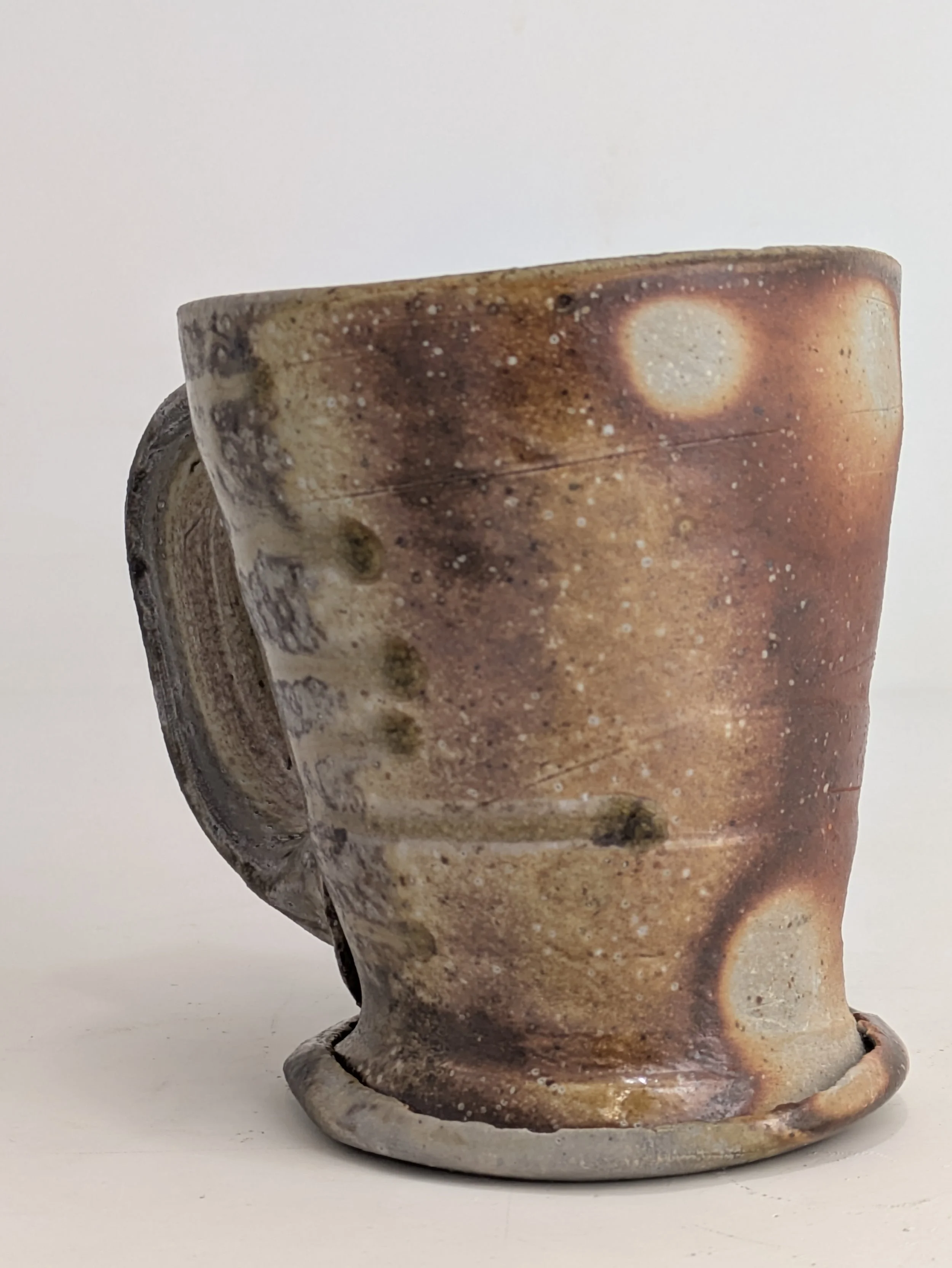 Wood fired mug with celadon glaze