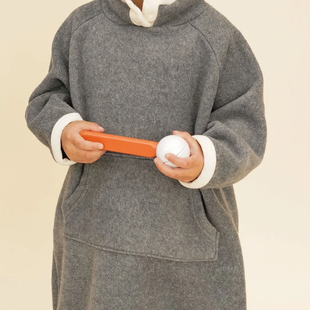 Close-up of the high collar with button details and contrast trim, emphasizing the soft plush fleece material of the kids' grey dress.