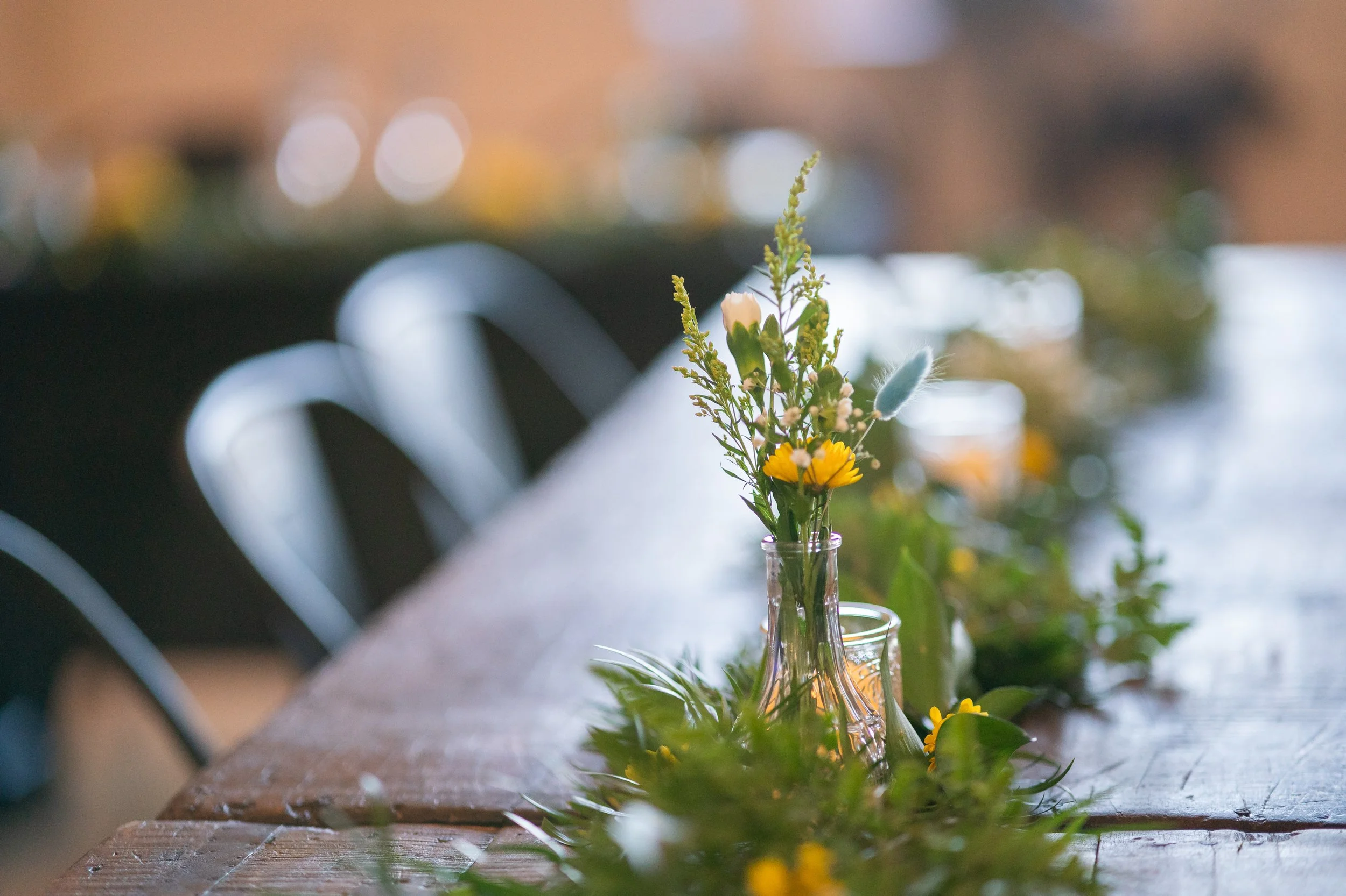 Rae Loft wedding furniture and available decorations, bud vase, votives, greenery