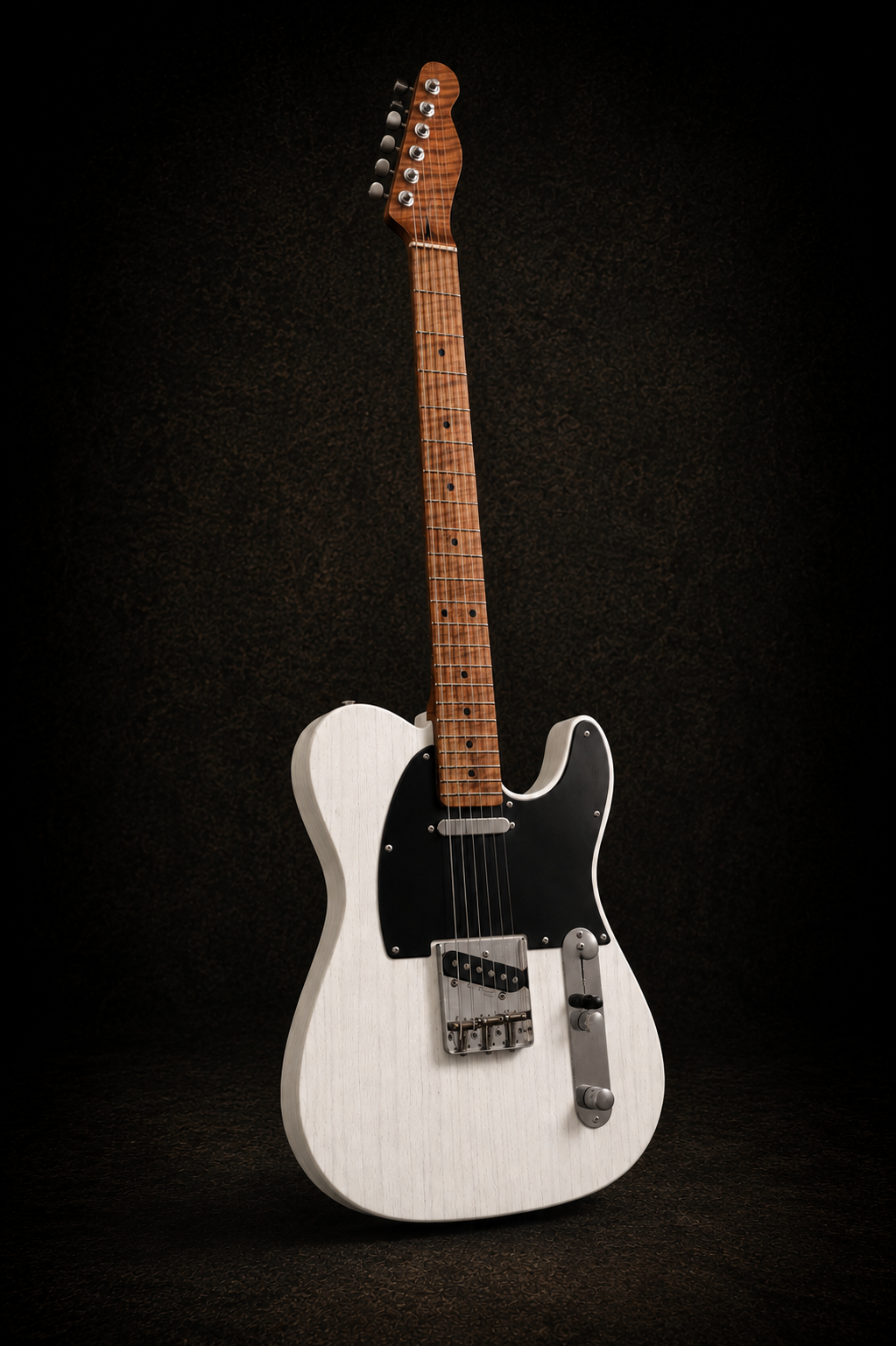 A white electric guitar with a black pickguard and a wooden neck, set against a dark background.