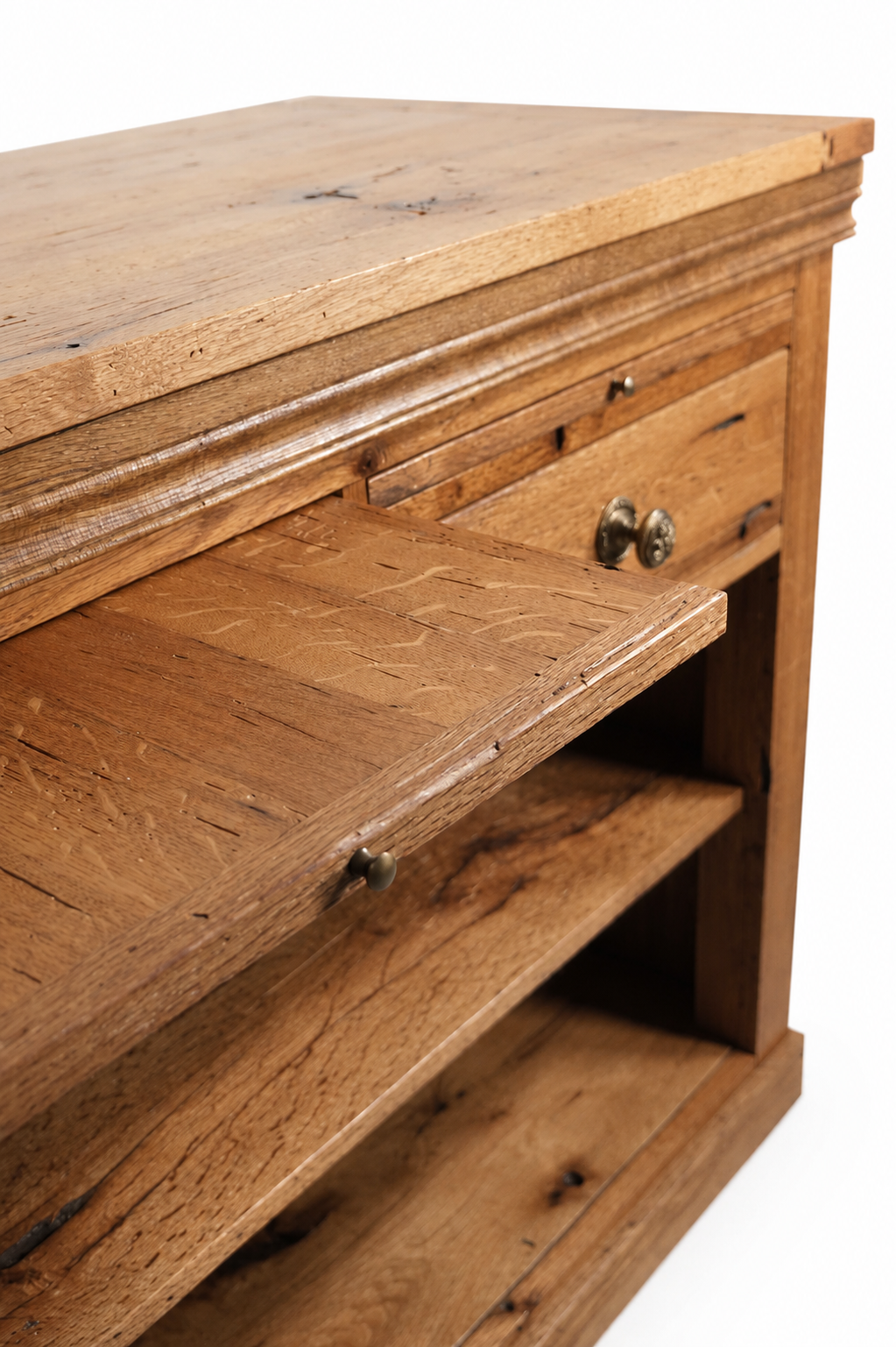 Close-up of a rustic wooden bookshelf with a partially pulled-out drawer, showing natural wood grain and metal knobs.