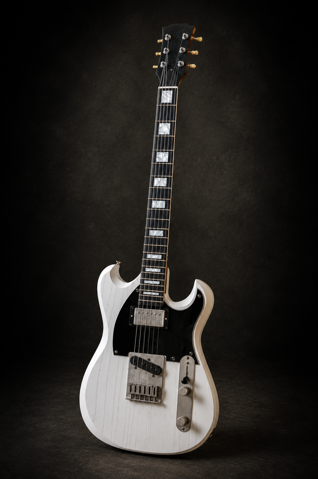 A white electric guitar with a black pickguard and silver hardware, standing upright against a dark background.