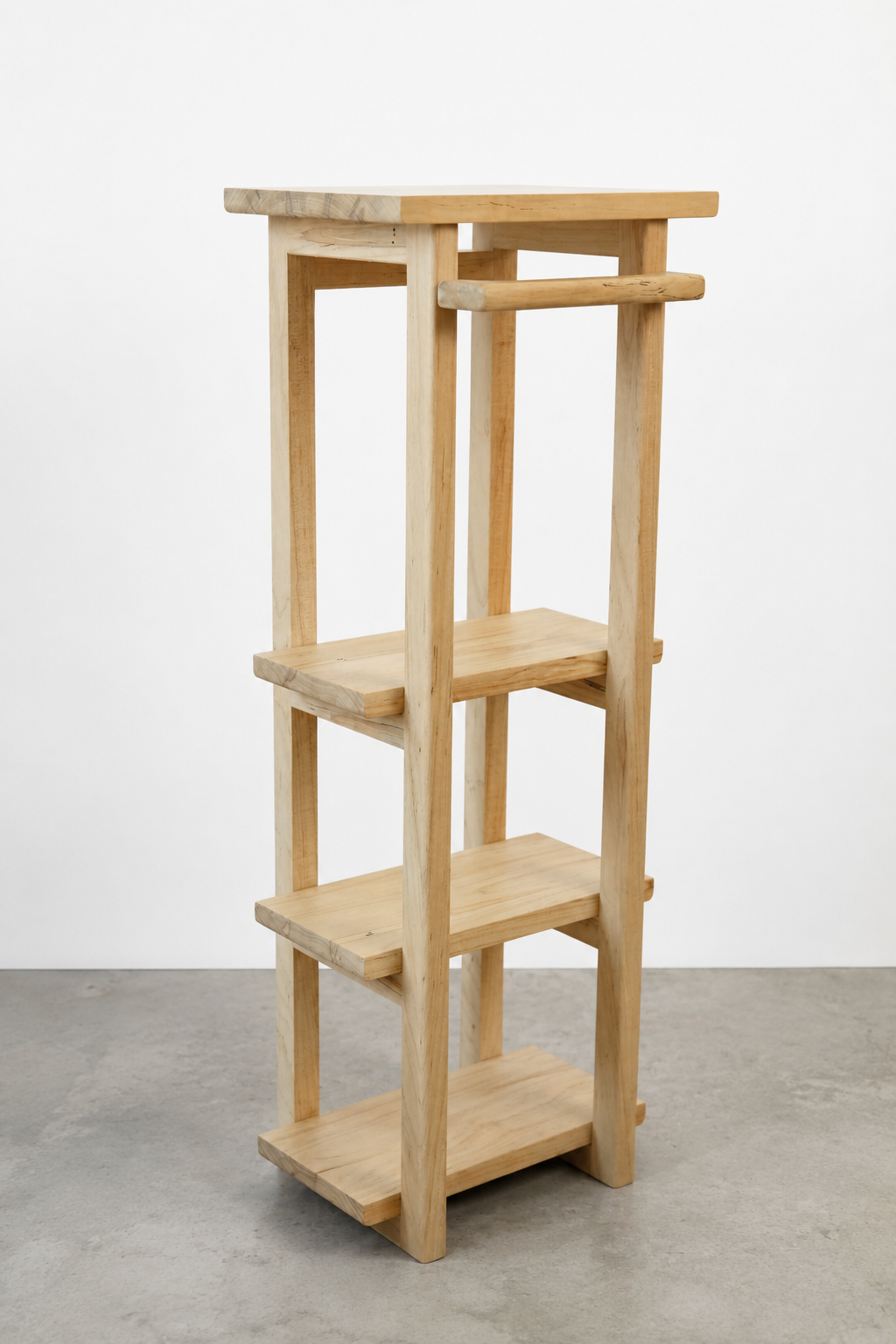 A wooden five-tiered plant stand with a light natural finish.