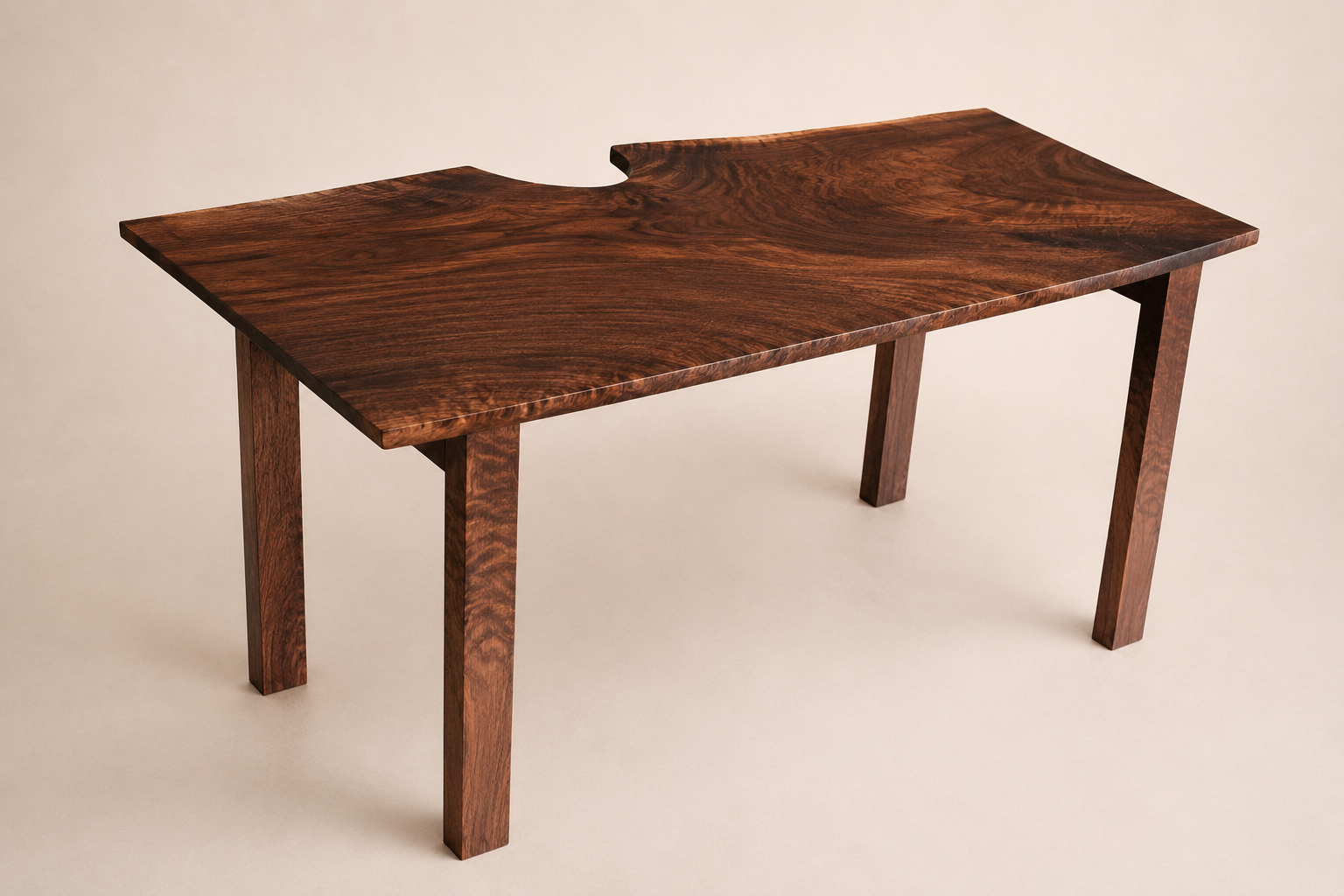 A wooden walnut table with a smooth, polished surface and a natural wood grain pattern, featuring a unique cutout edge design, set against a plain light-colored background.