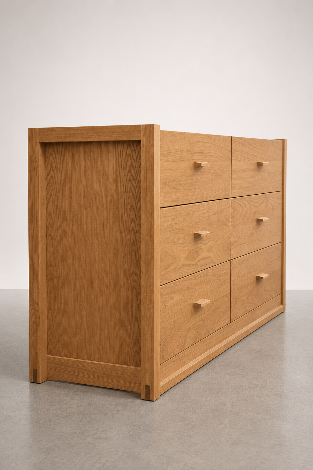 A wooden dresser with six drawers against a plain white background.