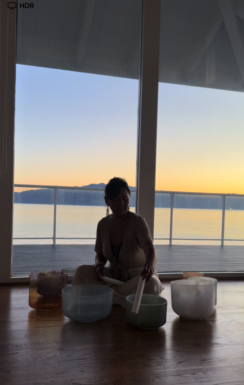 Suzette Alvarez playing Crystal Tones alchemy singing bowls at Villa Sol, Sunshine Coast BC