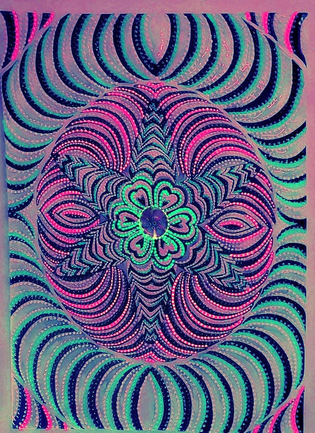 “Colorful symmetrical abstract painting with hypnotic circular patterns and central gem, exploring vibration and energy by artist Laura Garcia.”Colors on it: White, black,pink,blue in glow