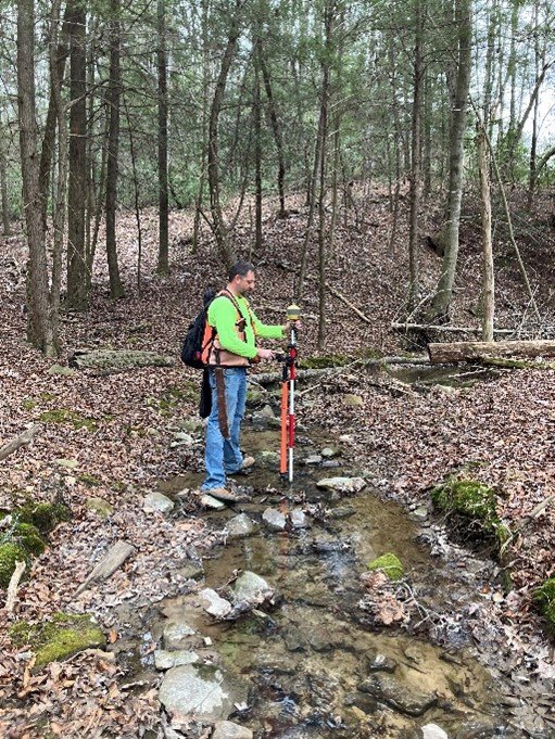 Portrait of Howard Hutcherson, Crew Chief leading field surveying operations.
