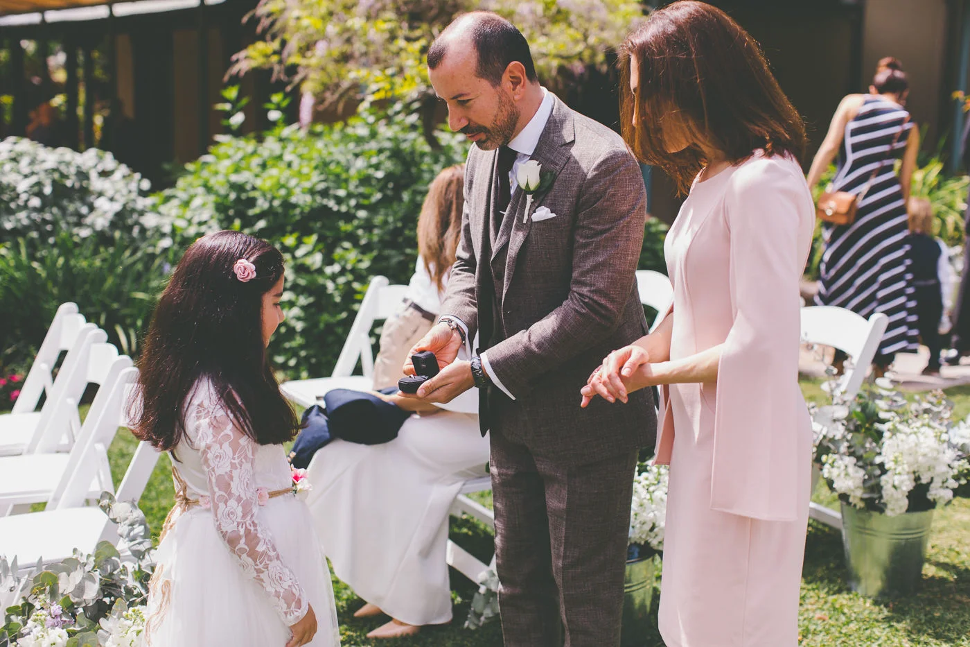 Wedding celebrant, groom and child with wedding rings at Lion Gate Lodge Sydney
